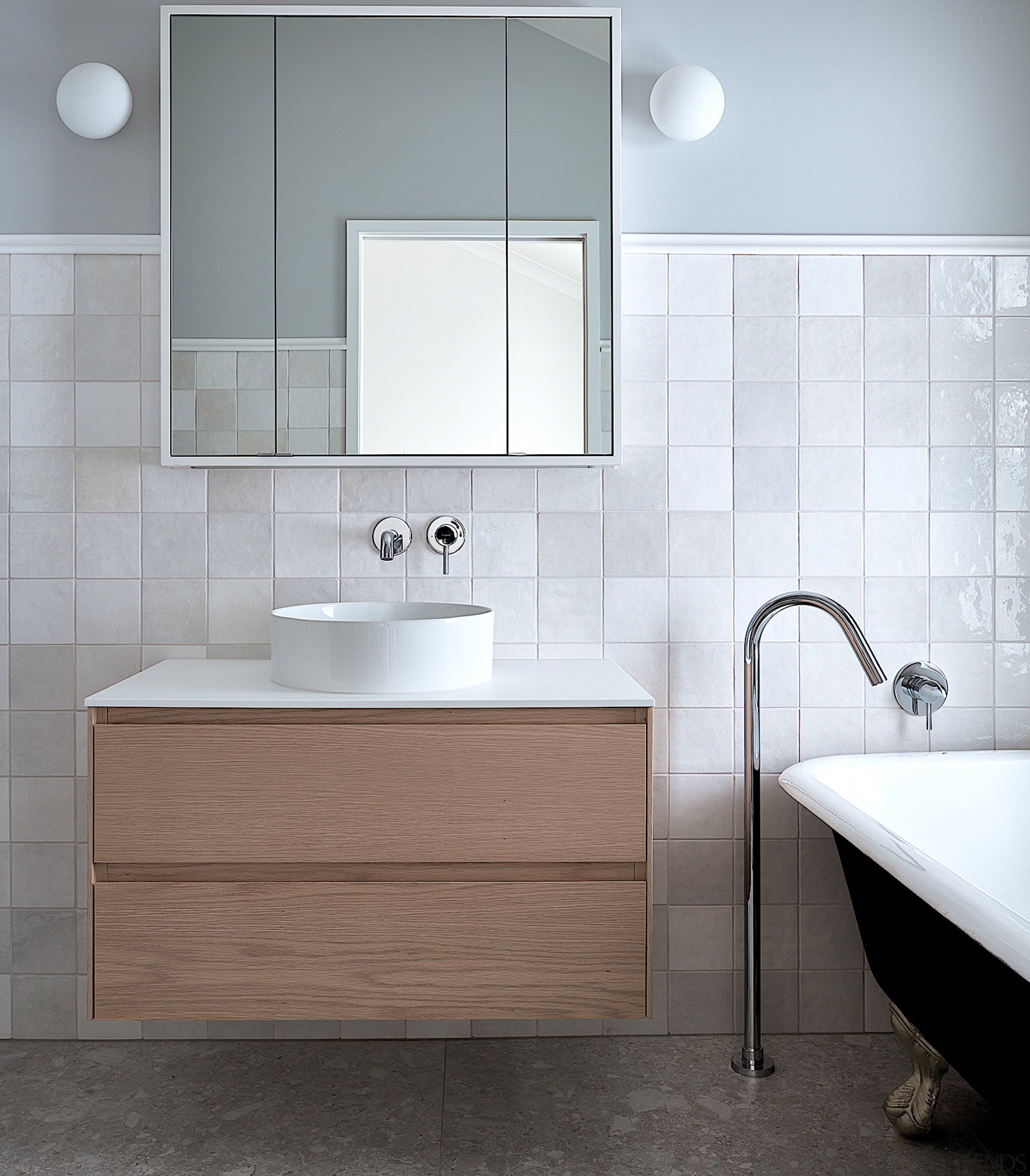 This bathroom’s dreamy material palette, traditional dado line 