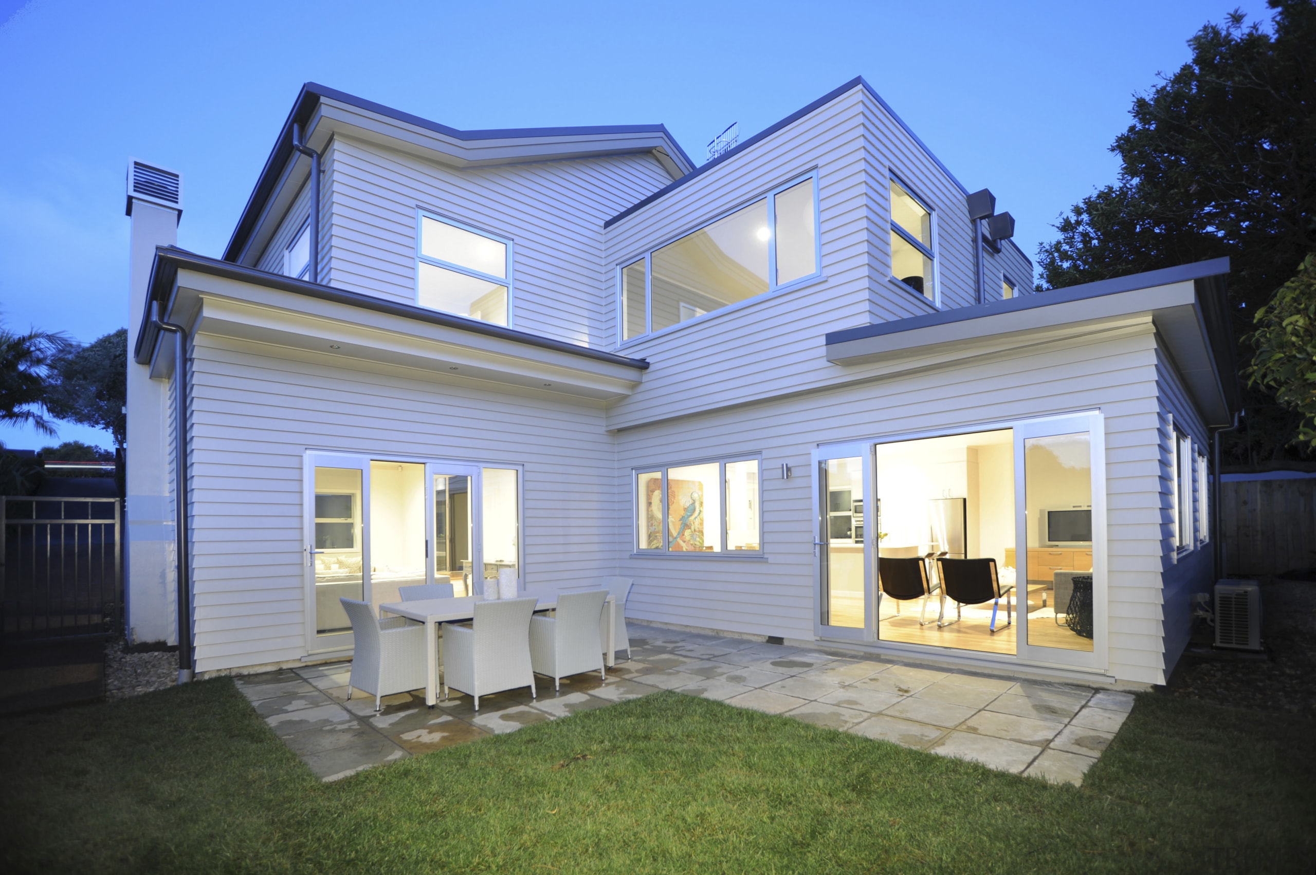 Exterior shot of the back of the house. cottage, elevation, estate, facade, home, house, property, real estate, residential area, roof, siding, window, teal