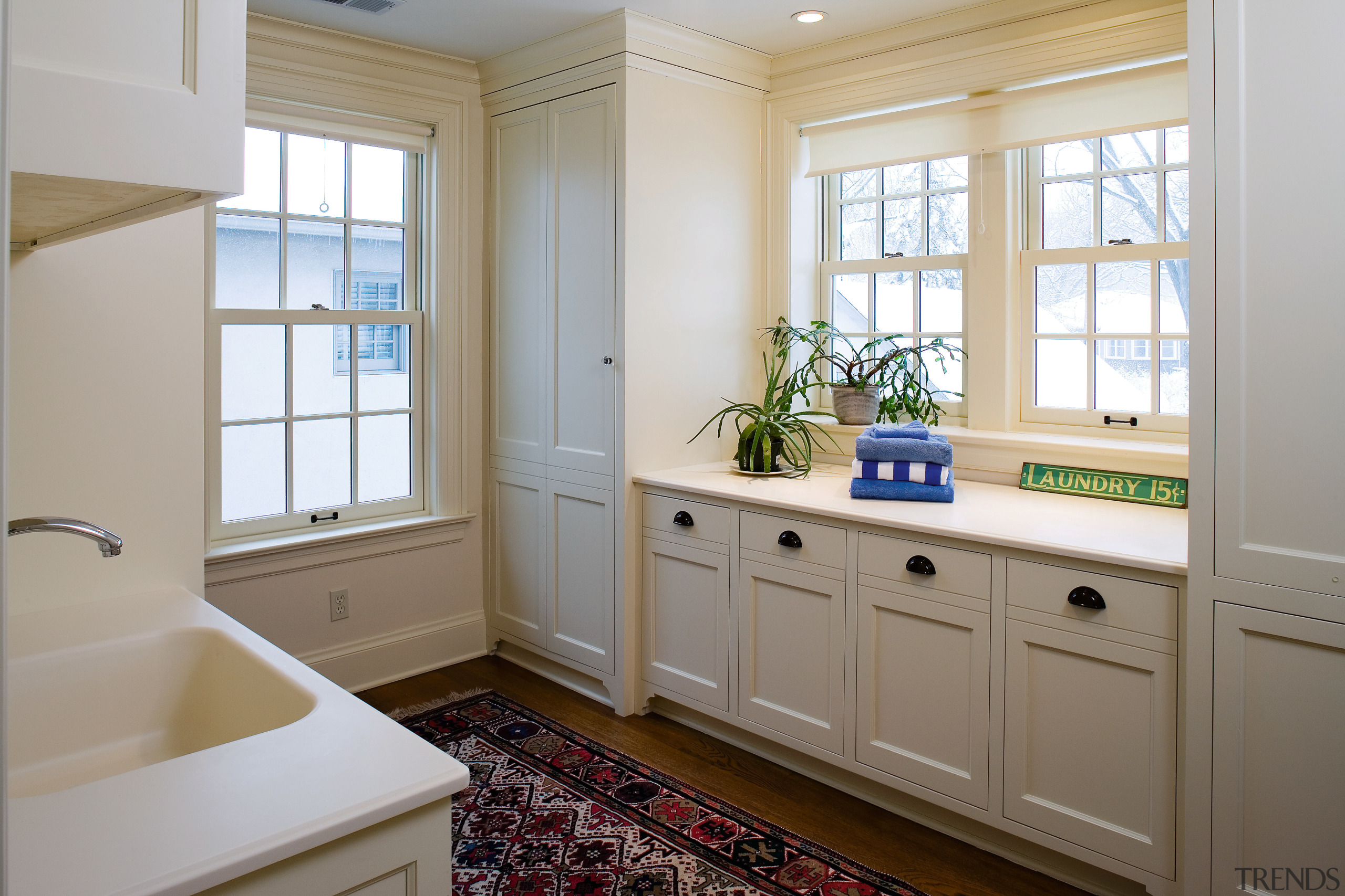 A view of this laundry featuring white timber bathroom, bathroom accessory, cabinetry, countertop, floor, home, interior design, kitchen, real estate, room, window, gray