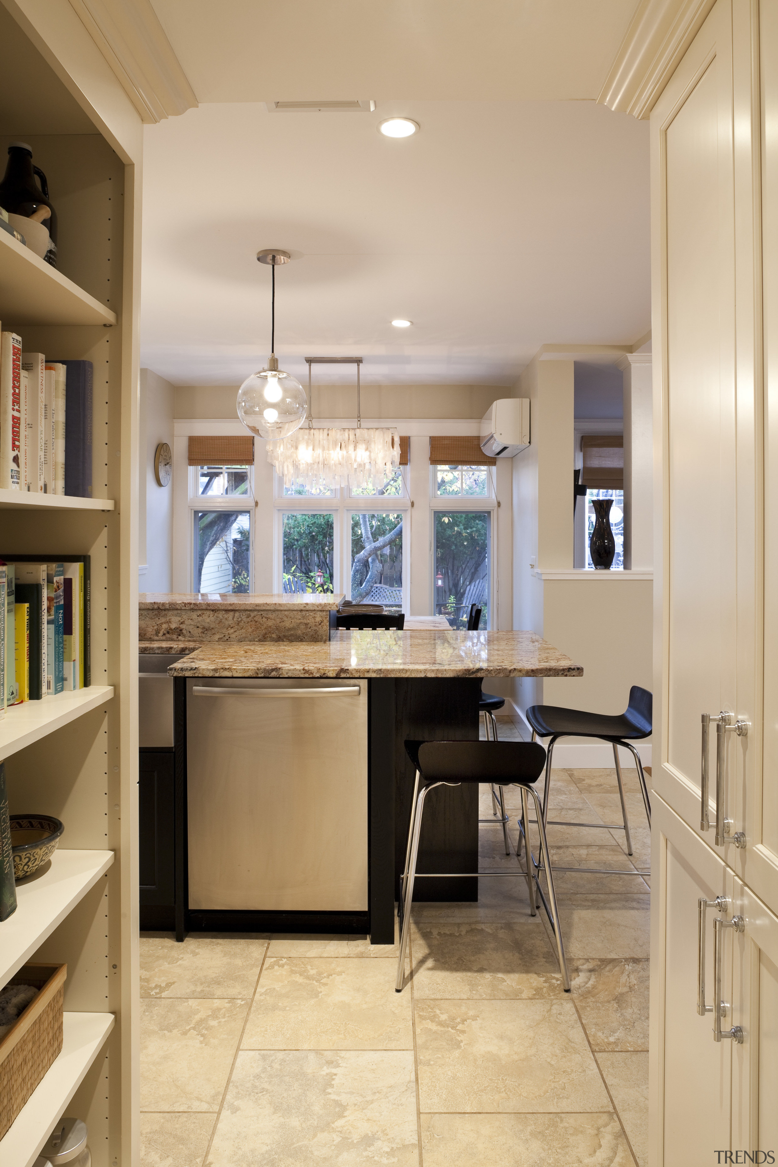 This kitchen was designed by Nadia Subaran of cabinetry, ceiling, countertop, cuisine classique, floor, flooring, interior design, kitchen, room, orange