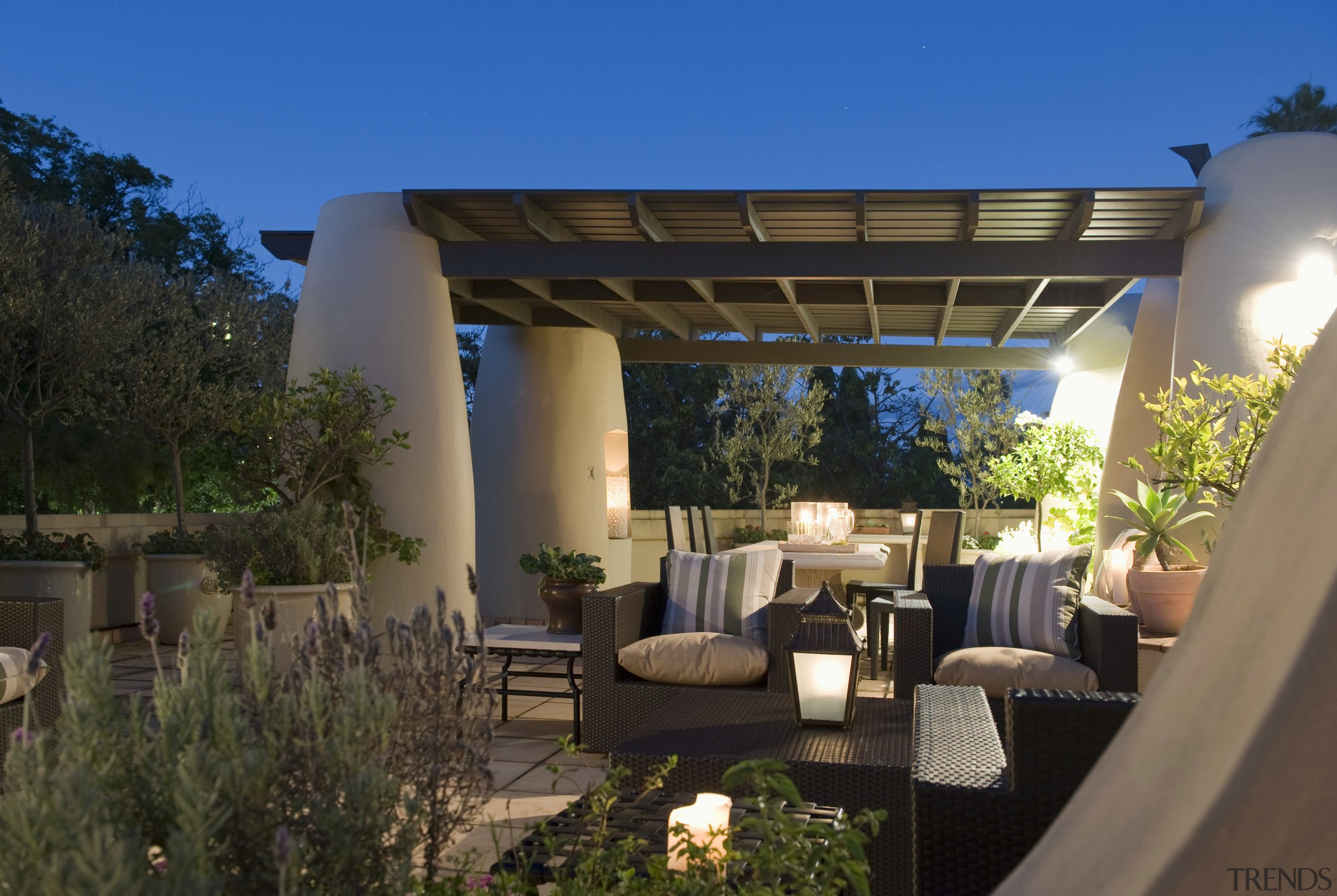 The designer aimed to limit the colour palette backyard, estate, home, house, outdoor structure, patio, property, real estate, roof, villa, brown