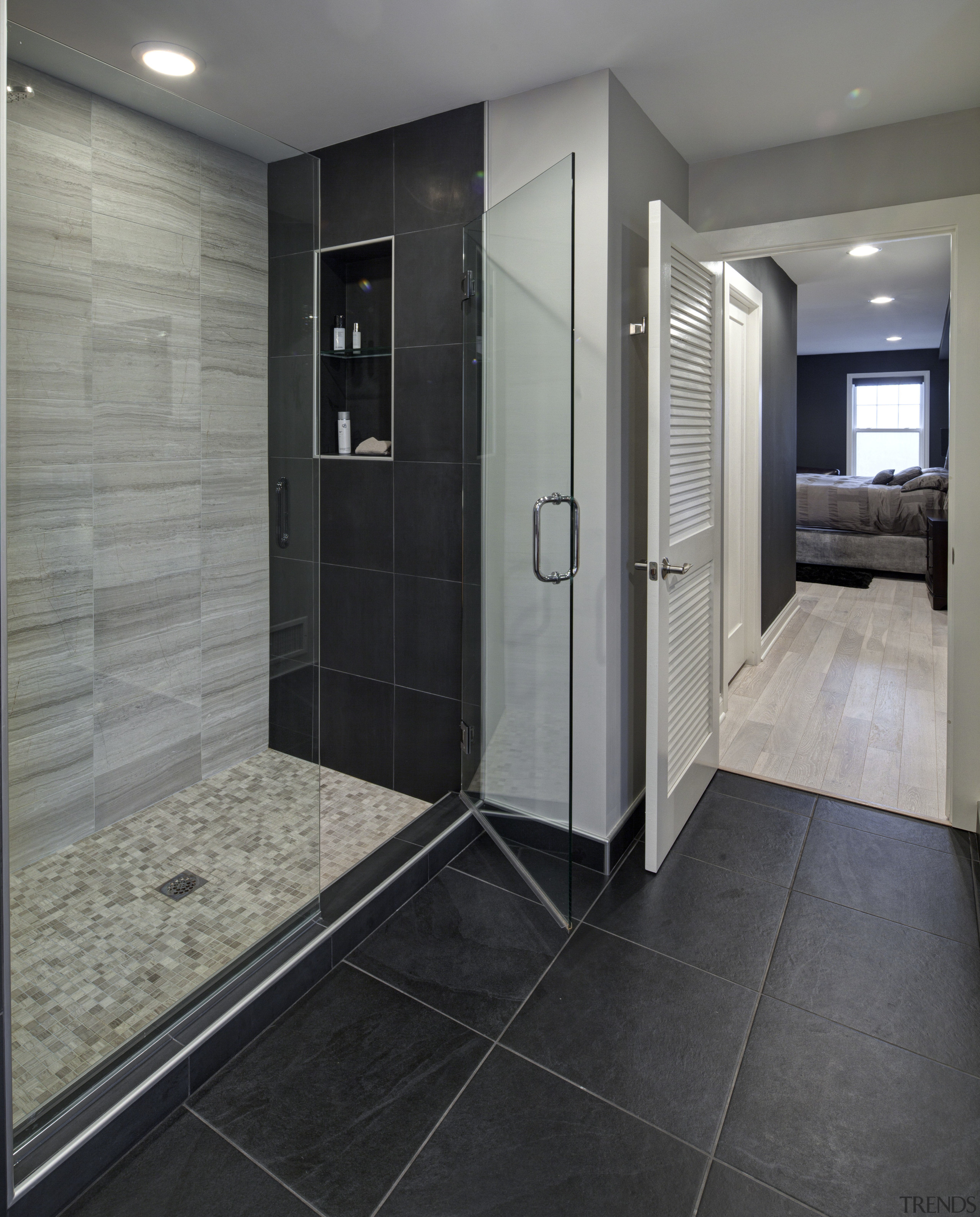 With glittering reflections, dancing flames and smooth textures, bathroom, floor, flooring, interior design, room, tile, gray, black