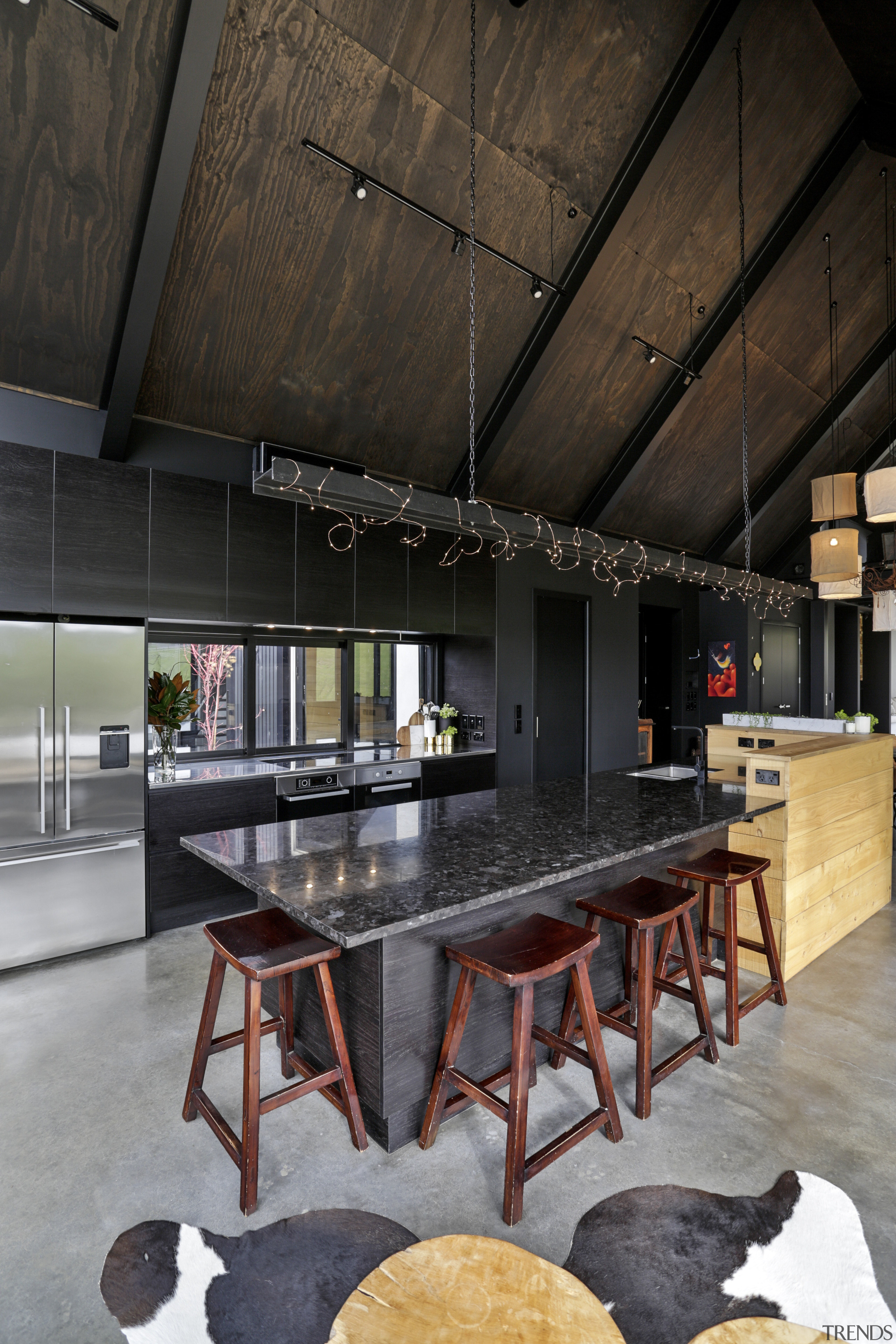 A suspended steel girder over this kitchen by architecture, house, interior design, table, black, gray