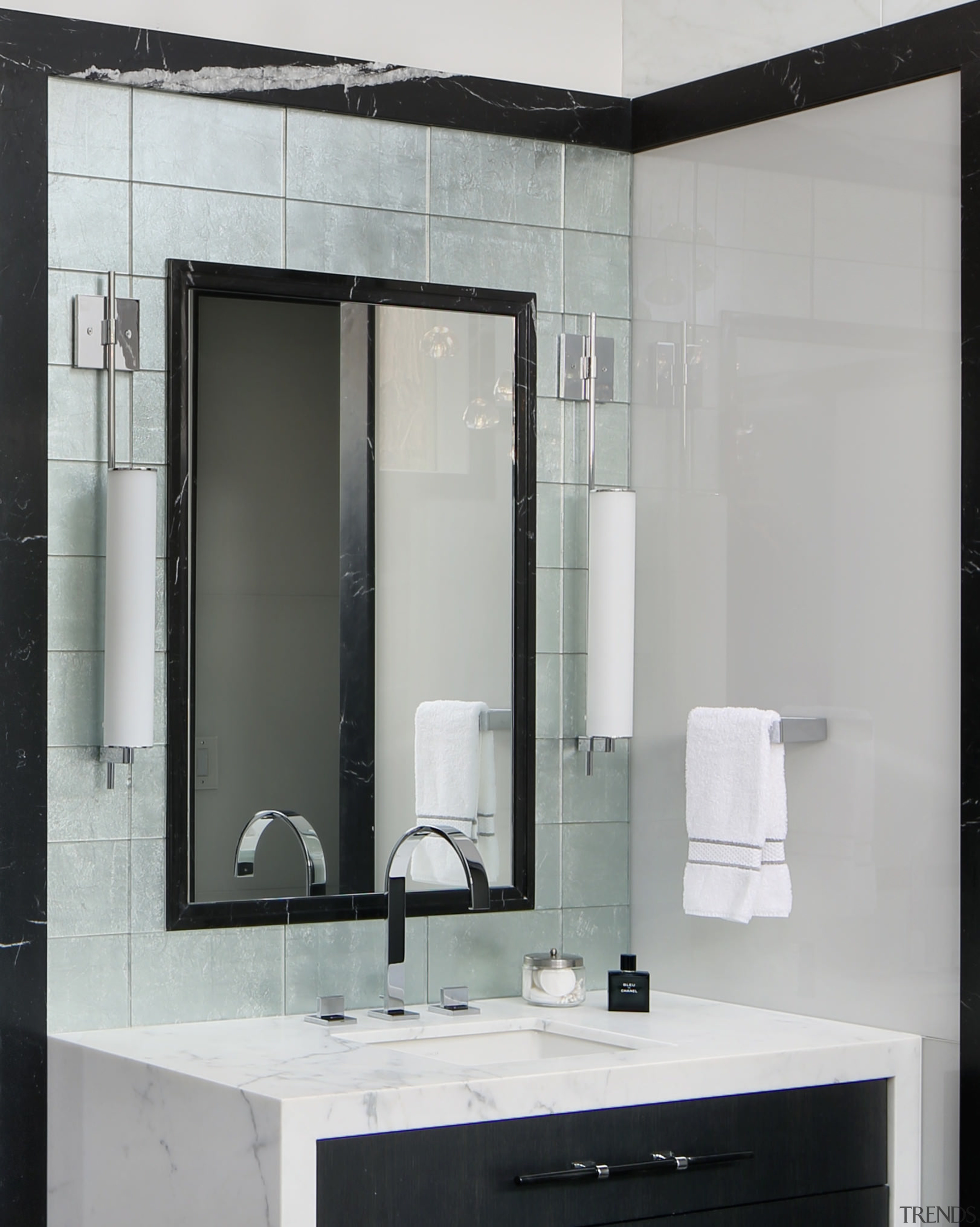 This vanity is backdropped by silver-backed tiles  bathroom, bathroom accessory, bathroom cabinet, glass, interior design, gray