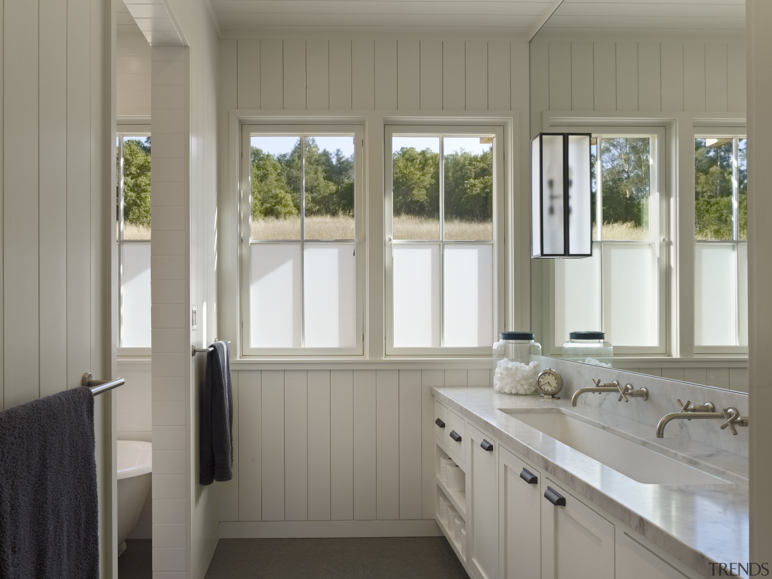 Simple white cabinetry is a feature of this door, home, interior design, property, real estate, room, window, gray