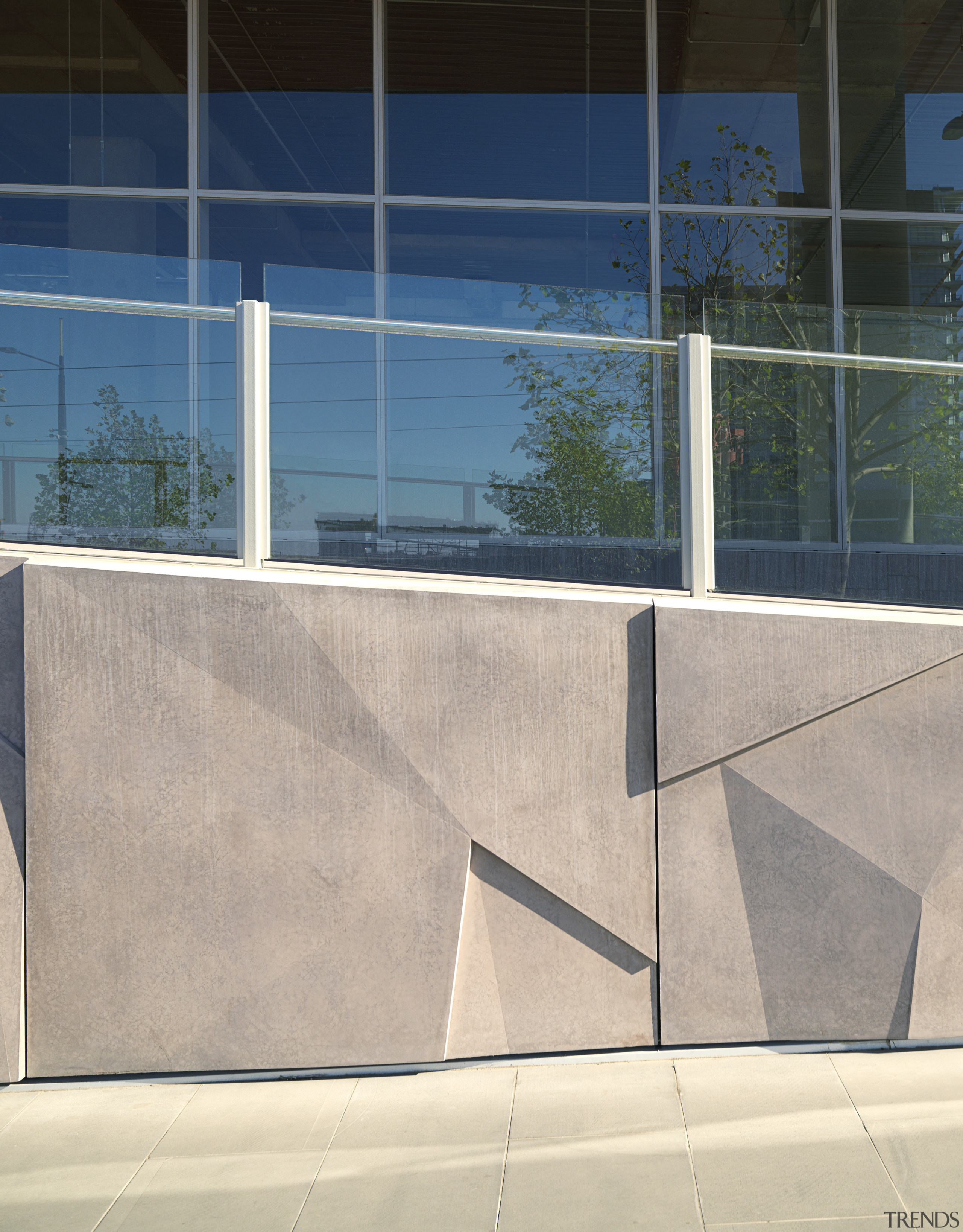 Glass reinforced panels (GRC) on exterior of commerical architecture, glass, handrail, line, wall, window, gray