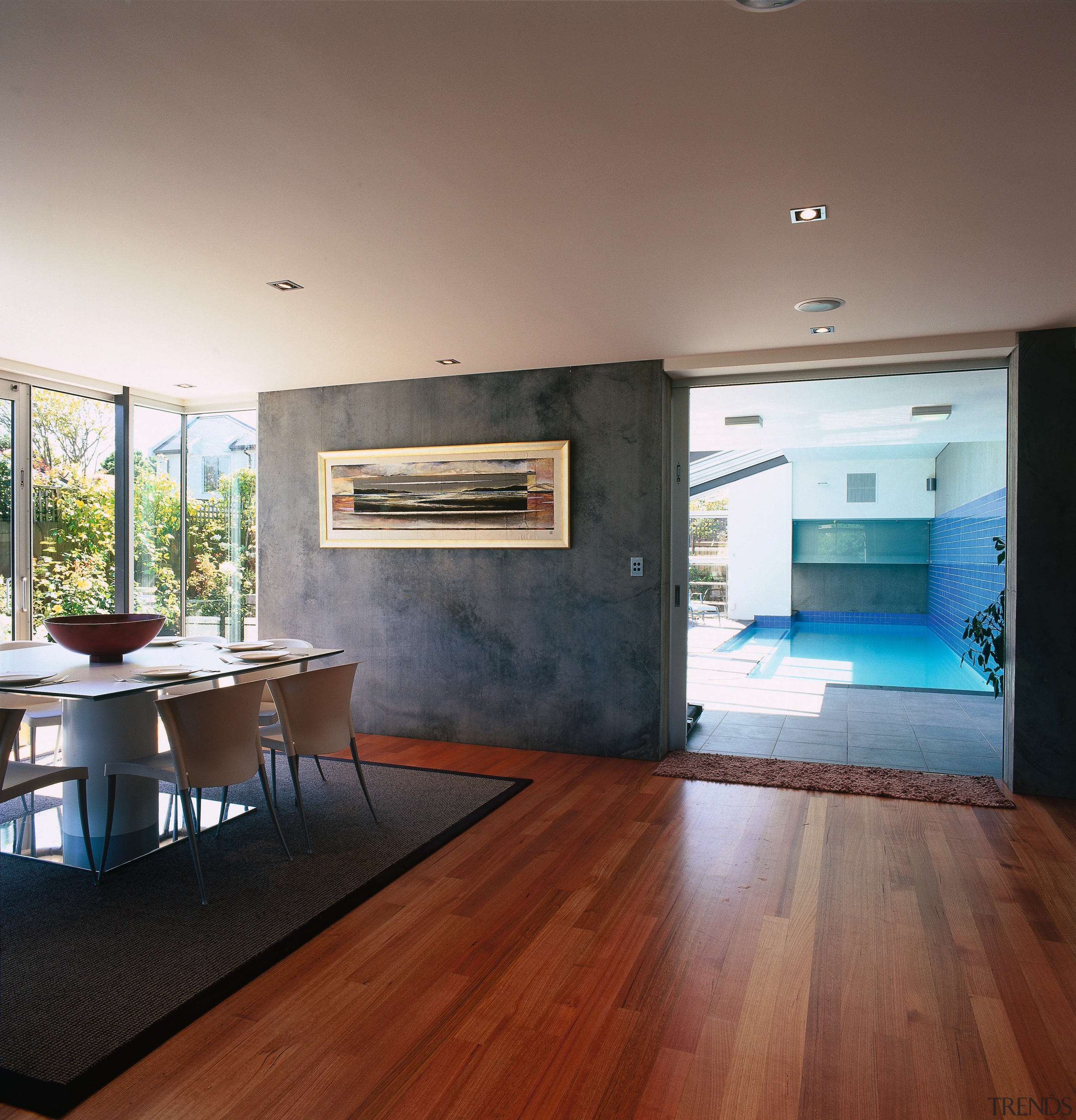 A interior view of the dining area featuring architecture, ceiling, daylighting, floor, flooring, hardwood, house, interior design, laminate flooring, living room, loft, real estate, room, wood, wood flooring, gray, brown