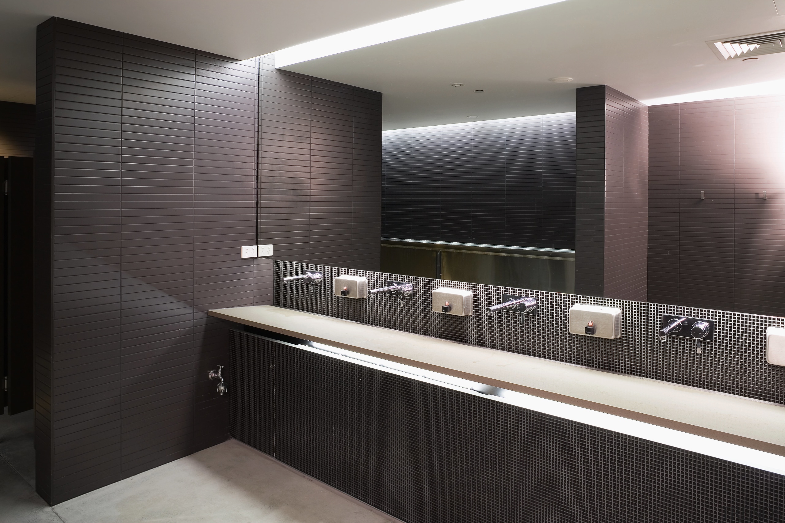 A view of some plubing by Beavis and bathroom, interior design, room, sink, black, gray