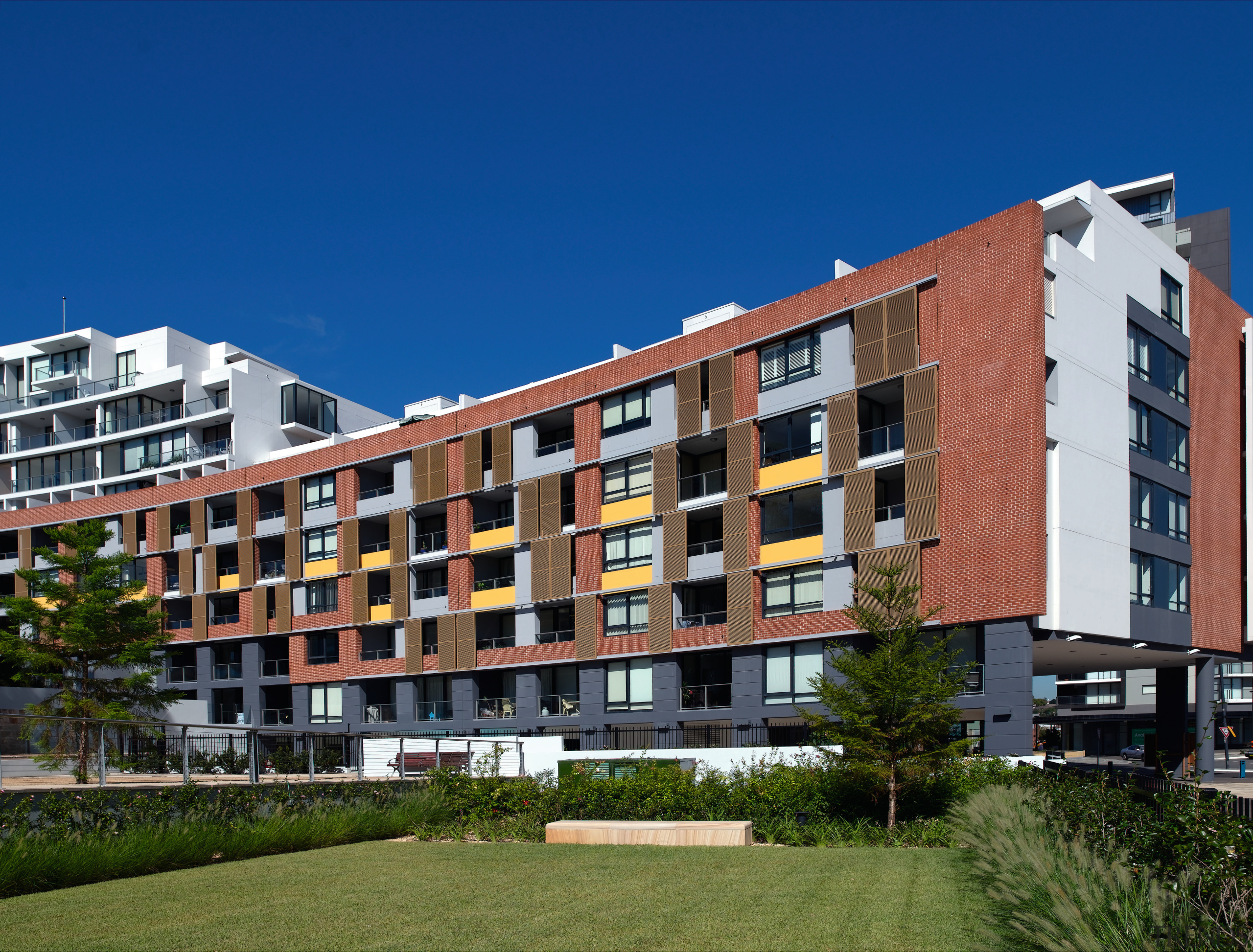 An exterior view of this multi storey apartment apartment, architecture, building, city, condominium, corporate headquarters, elevation, estate, facade, home, house, metropolitan area, mixed use, neighbourhood, property, real estate, residential area, sky, suburb, tower block, blue