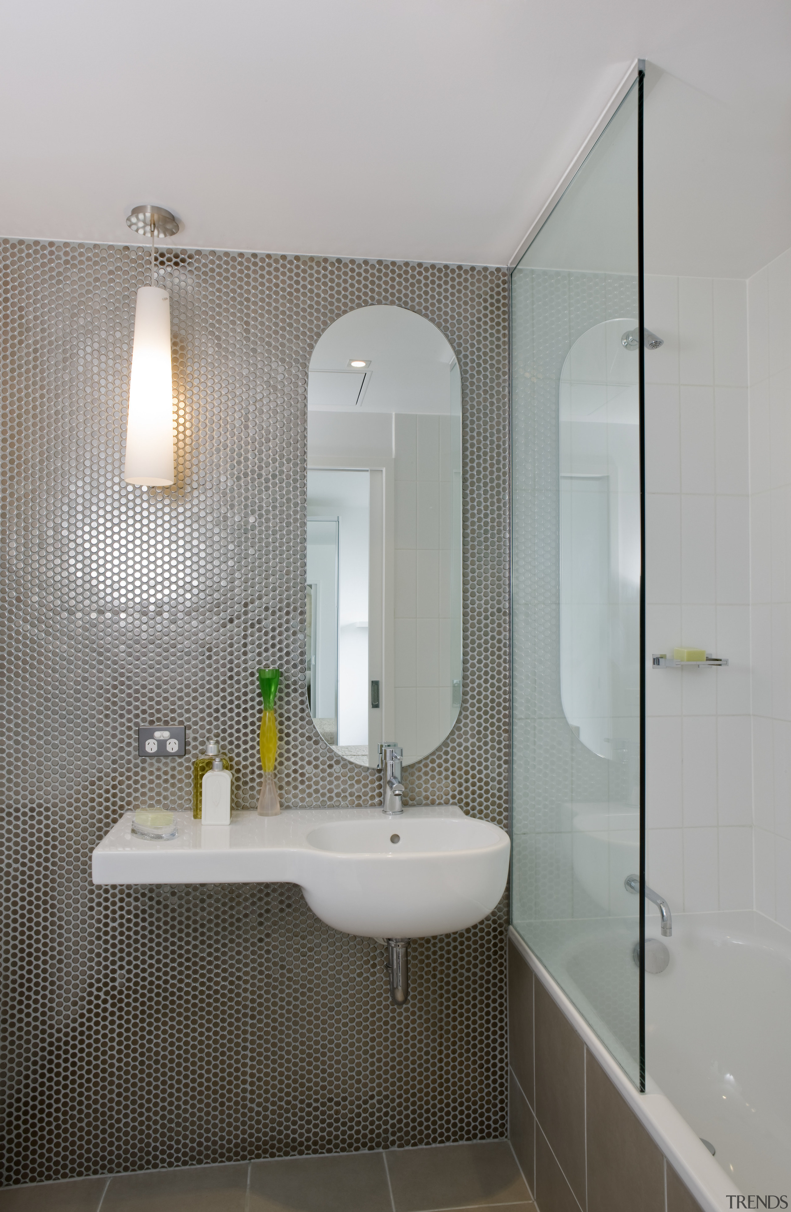 View of bathroom with bathtub that includes a architecture, bathroom, bathroom accessory, bathroom cabinet, ceiling, floor, interior design, plumbing fixture, room, sink, tap, tile, wall, gray