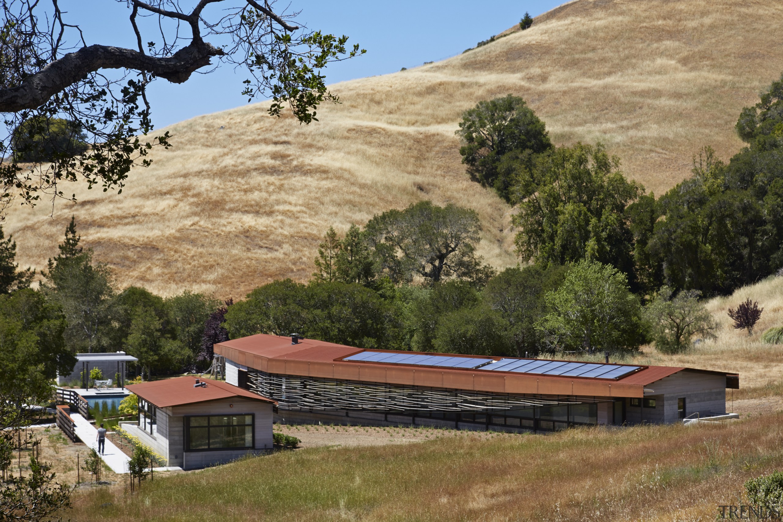 Photovoltaic and solar thermal panels on the roof geological phenomenon, hill, hill station, home, house, landscape, mountain, national park, property, real estate, roof, rural area, sky, soil, tree, village, wilderness, brown, orange