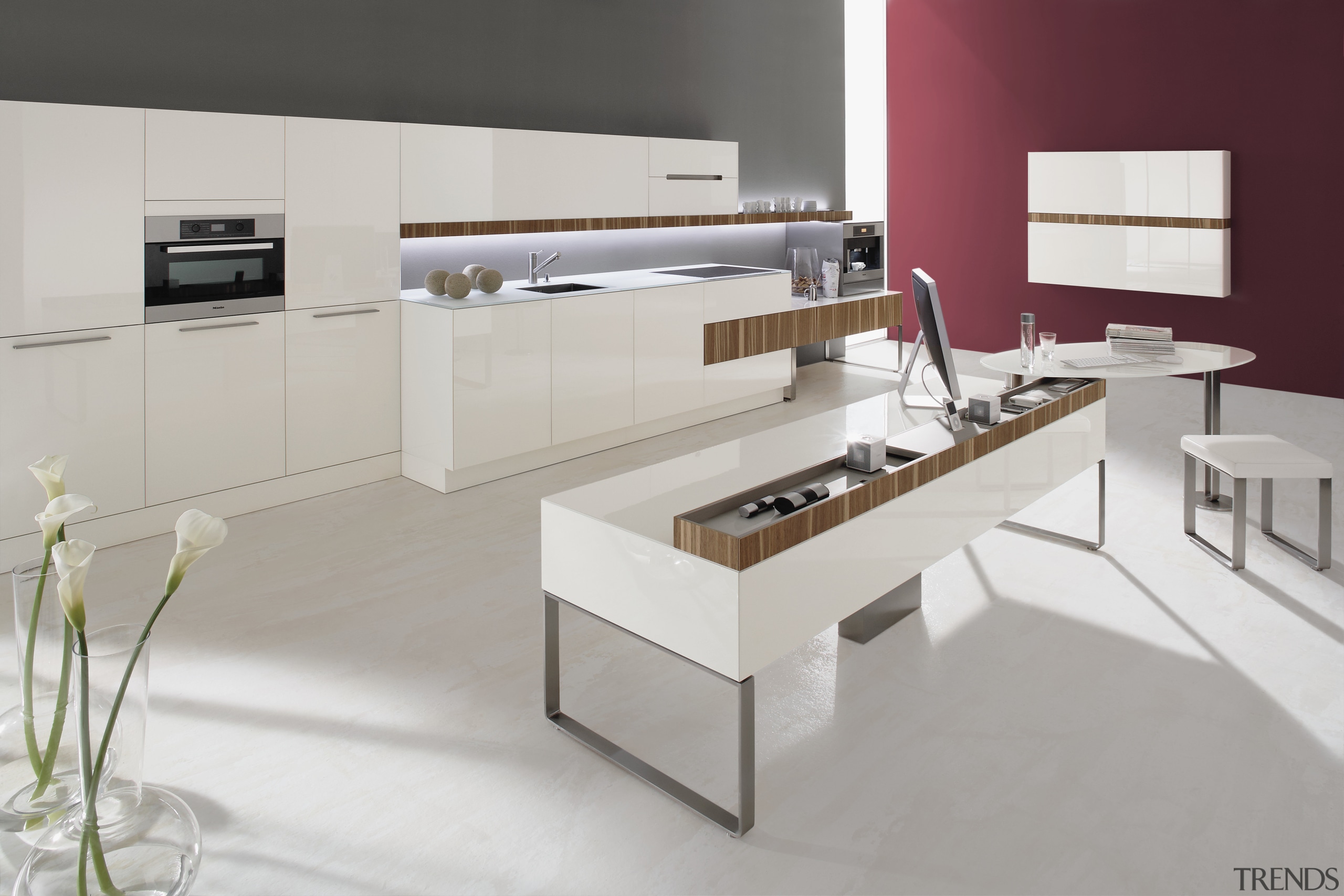 This emotoin kitchen features glossy white cabinetry with furniture, interior design, kitchen, product, product design, table, gray