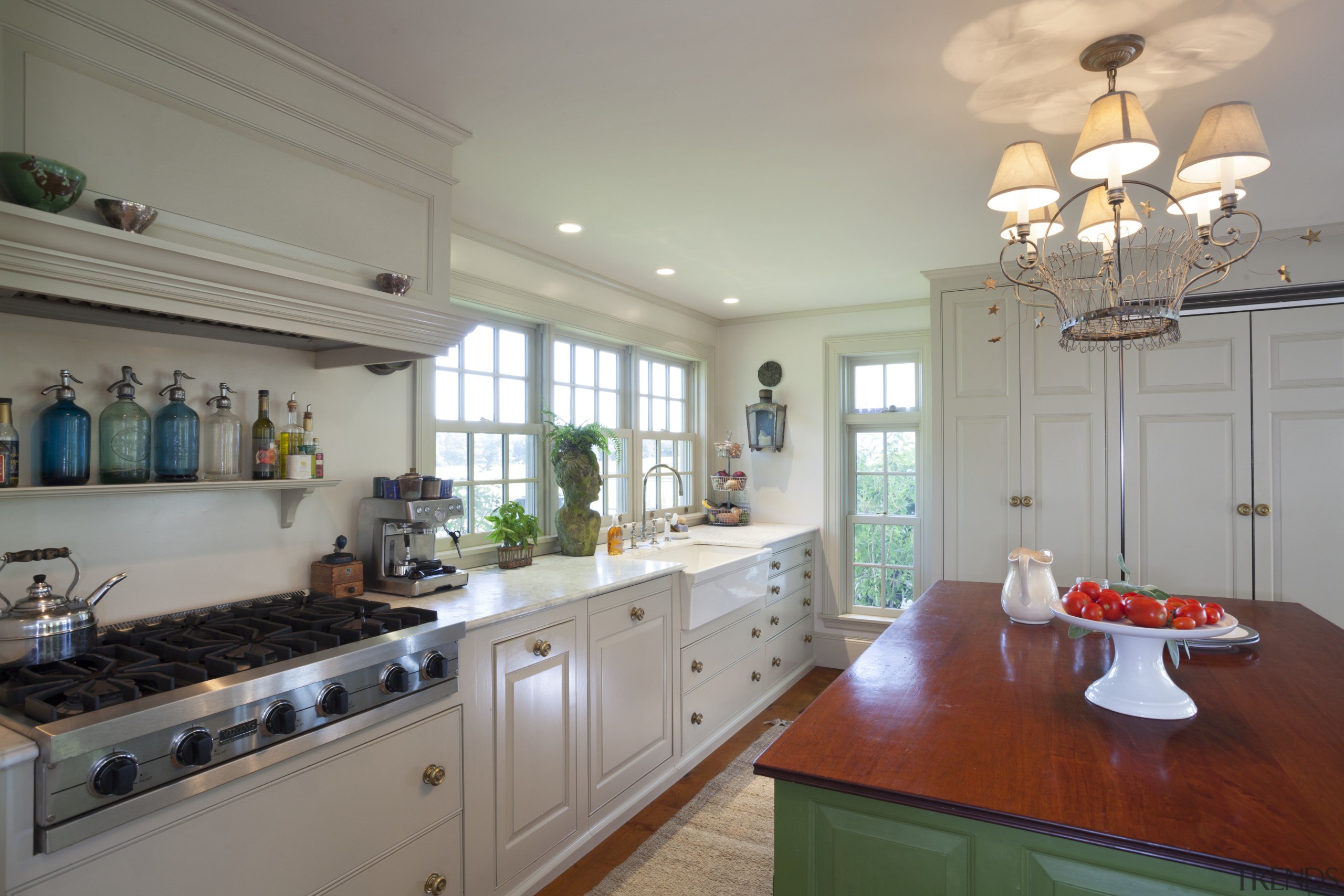 This kitchen blends with its surroundings through architectural cabinetry, ceiling, countertop, cuisine classique, home, interior design, kitchen, property, real estate, room, gray