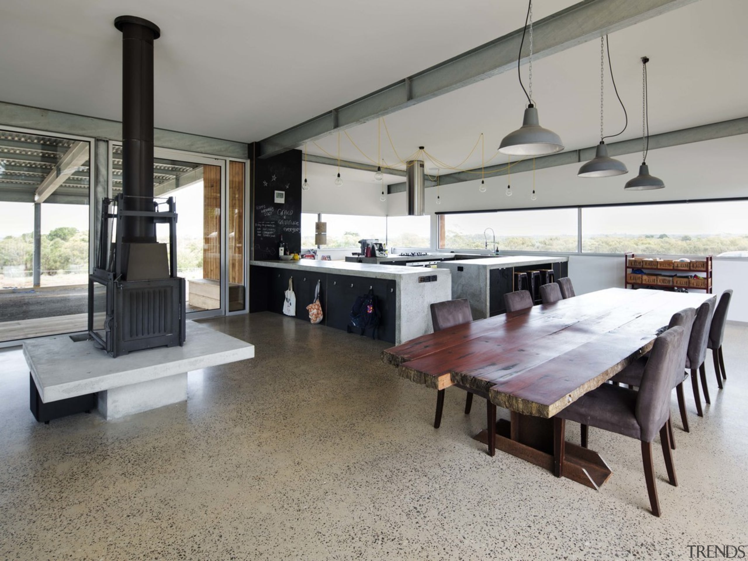 The expansive windows in the kitchen make the floor, flooring, interior design, property, real estate, gray