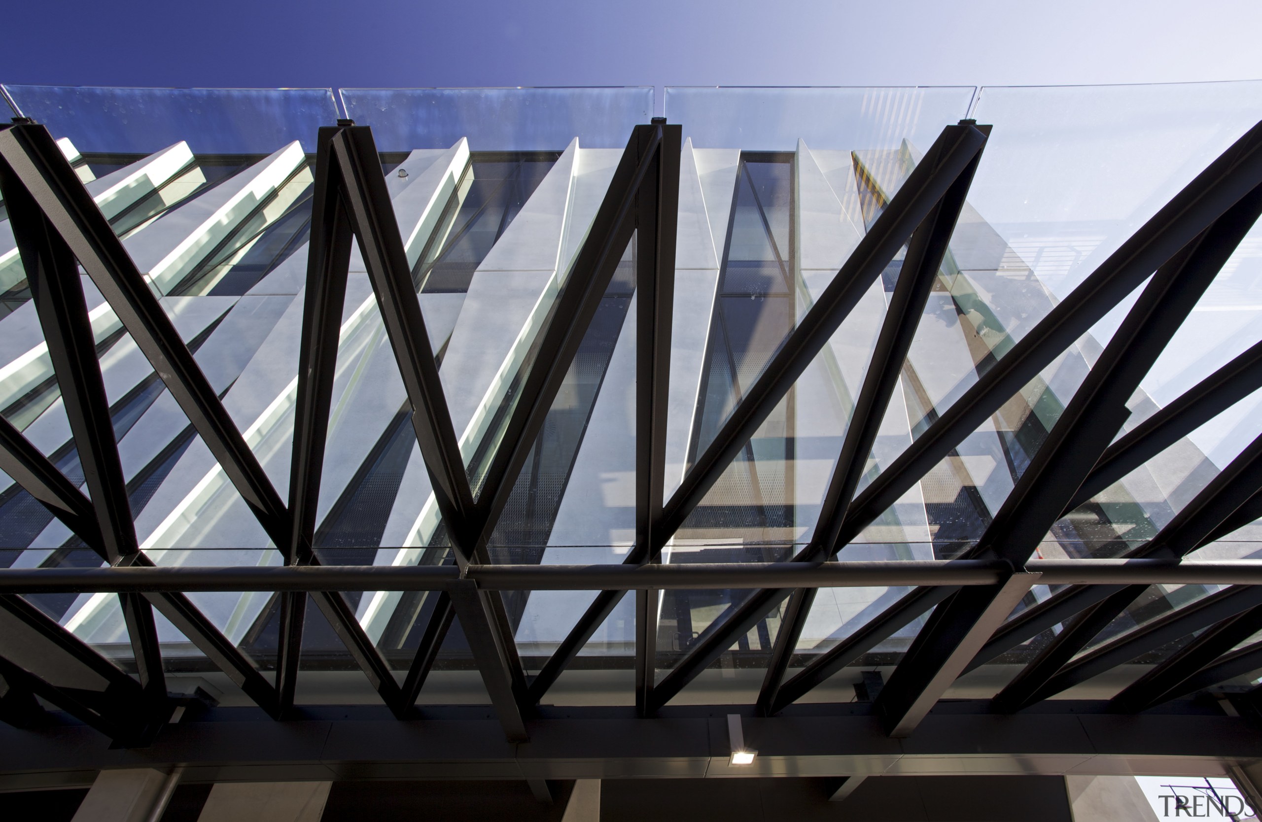 Merchant Quarter boasts a dramatic facade  conceived angle, architecture, building, daylighting, daytime, facade, glass, line, metal, roof, sky, structure, symmetry, black, gray