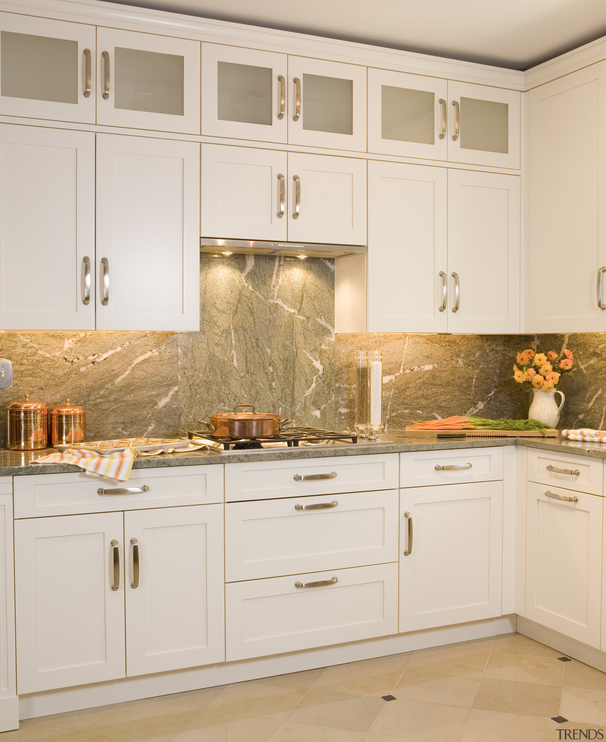 Image of a showroom kitchen at the A&amp;D cabinetry, countertop, cuisine classique, floor, flooring, furniture, home, interior design, kitchen, room, under cabinet lighting, wall, white, orange