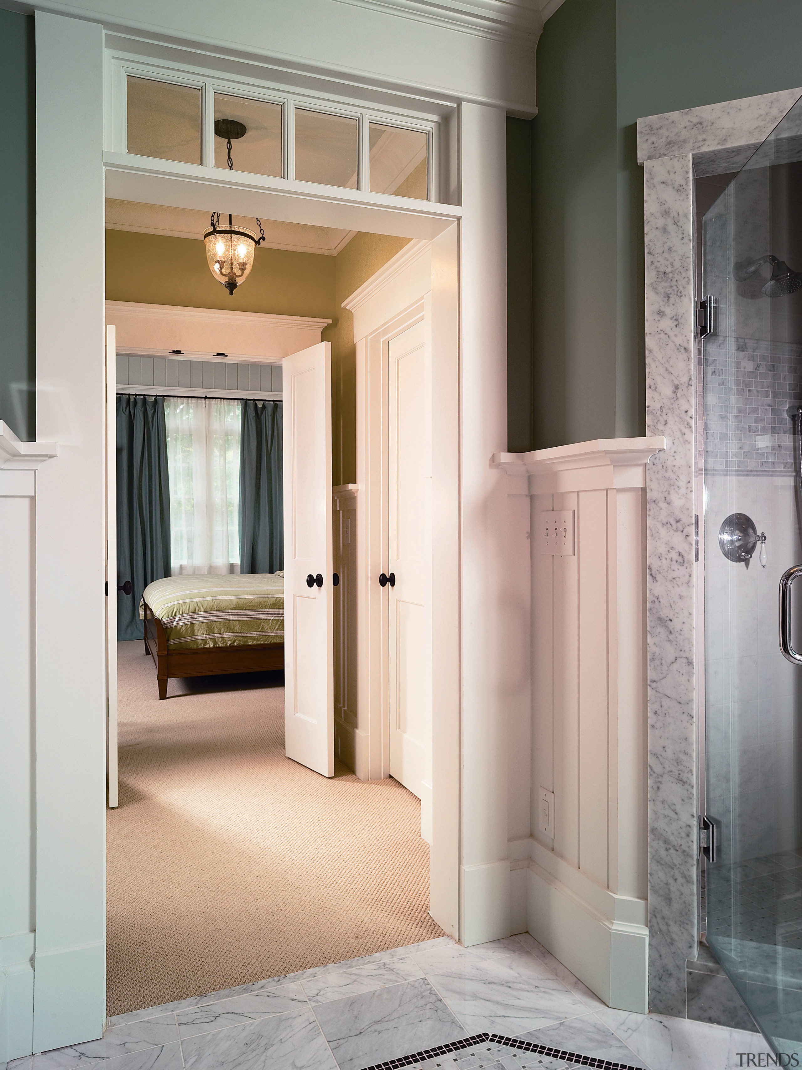 A view of the shower stall. - A door, floor, flooring, home, interior design, real estate, room, window, gray