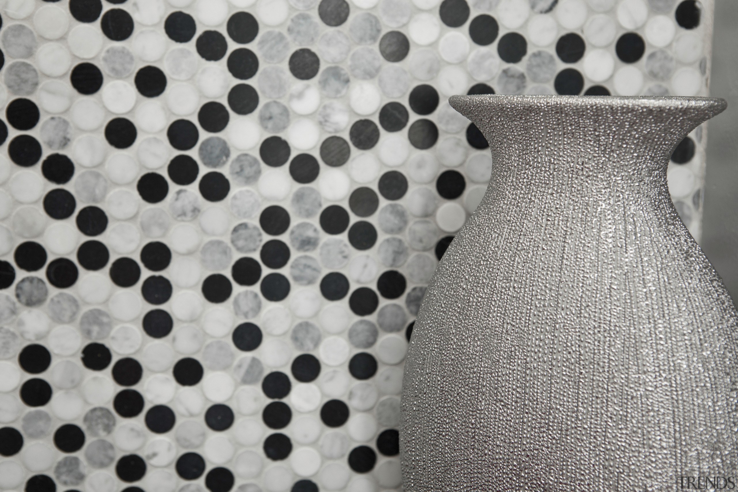 View of silver pot with spotted wall covering. design, dress, pattern, polka dot, textile, gray