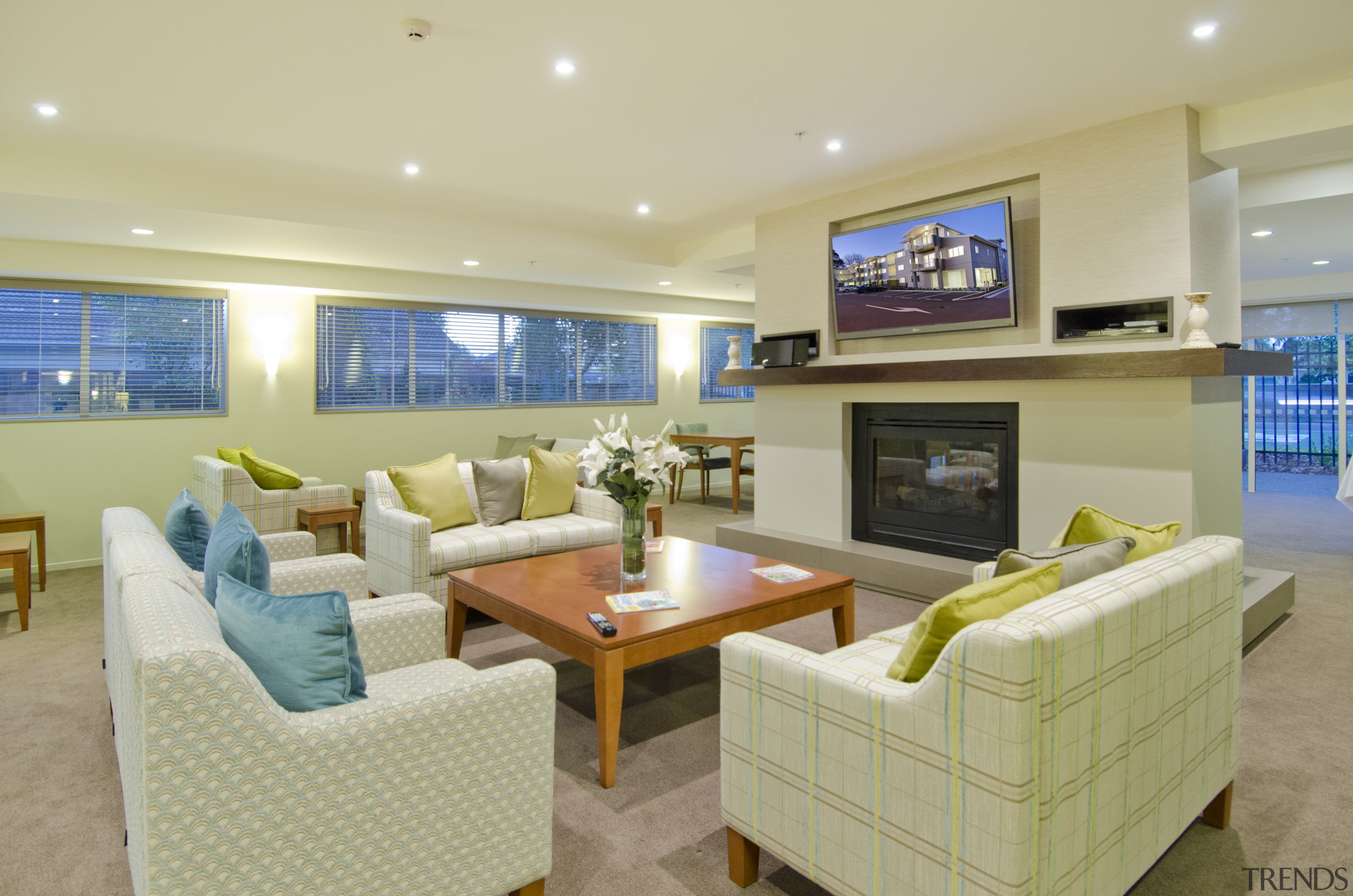 Bupa Parklands on Papanui Village features a wide estate, home, interior design, living room, real estate, room, orange, yellow