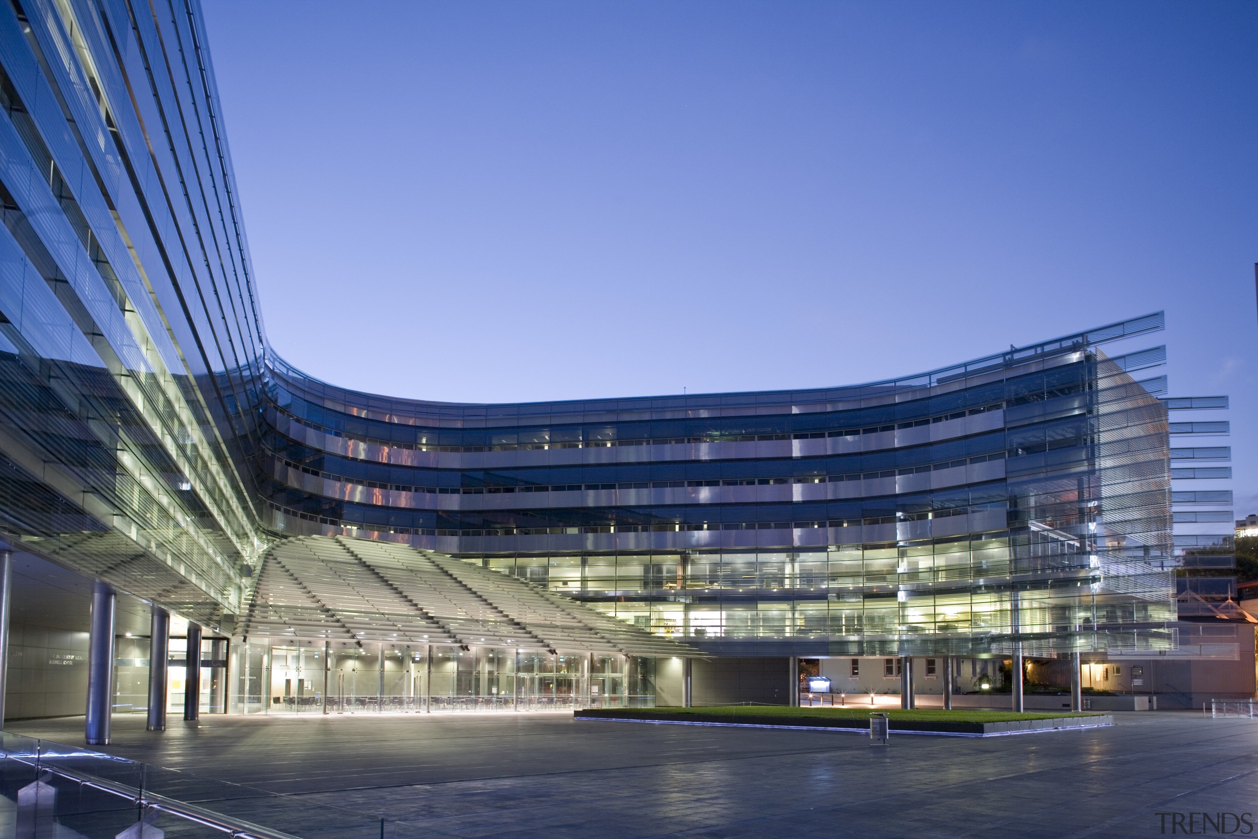 View of the exterior of the Owen G architecture, building, city, commercial building, condominium, convention center, corporate headquarters, daytime, headquarters, landmark, metropolis, metropolitan area, mixed use, reflection, sky, structure, blue