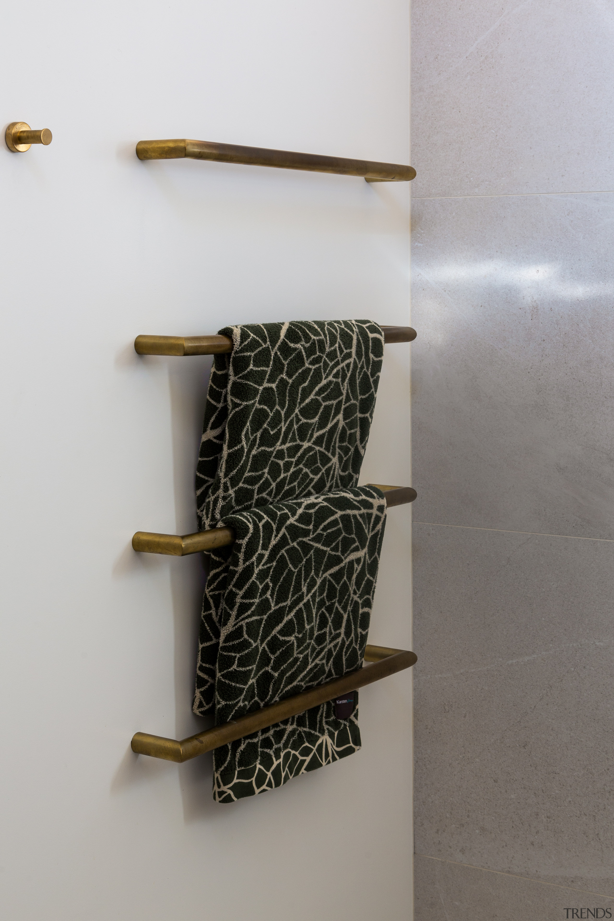 ​​​​​​​Brass accessories complement the wider material palette in 