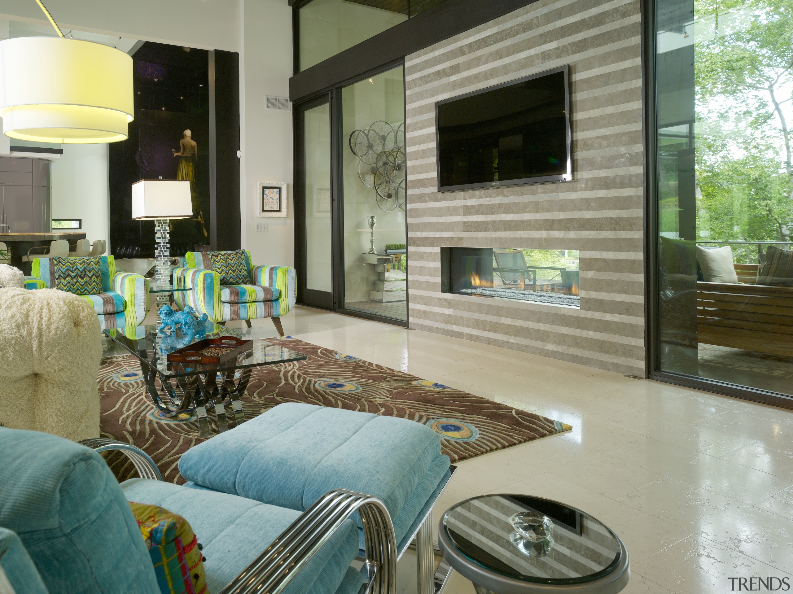 The double-sided Montigo fireplace in this house has estate, floor, home, interior design, living room, property, real estate, room, window, gray