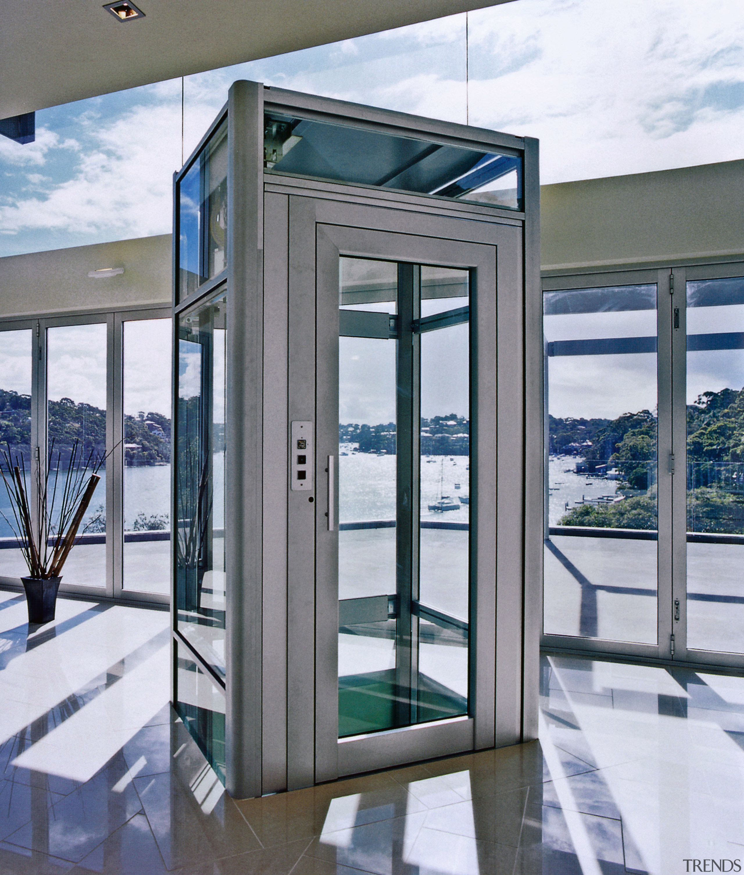 View of small elevator with glass door and door, glass, window, gray, white