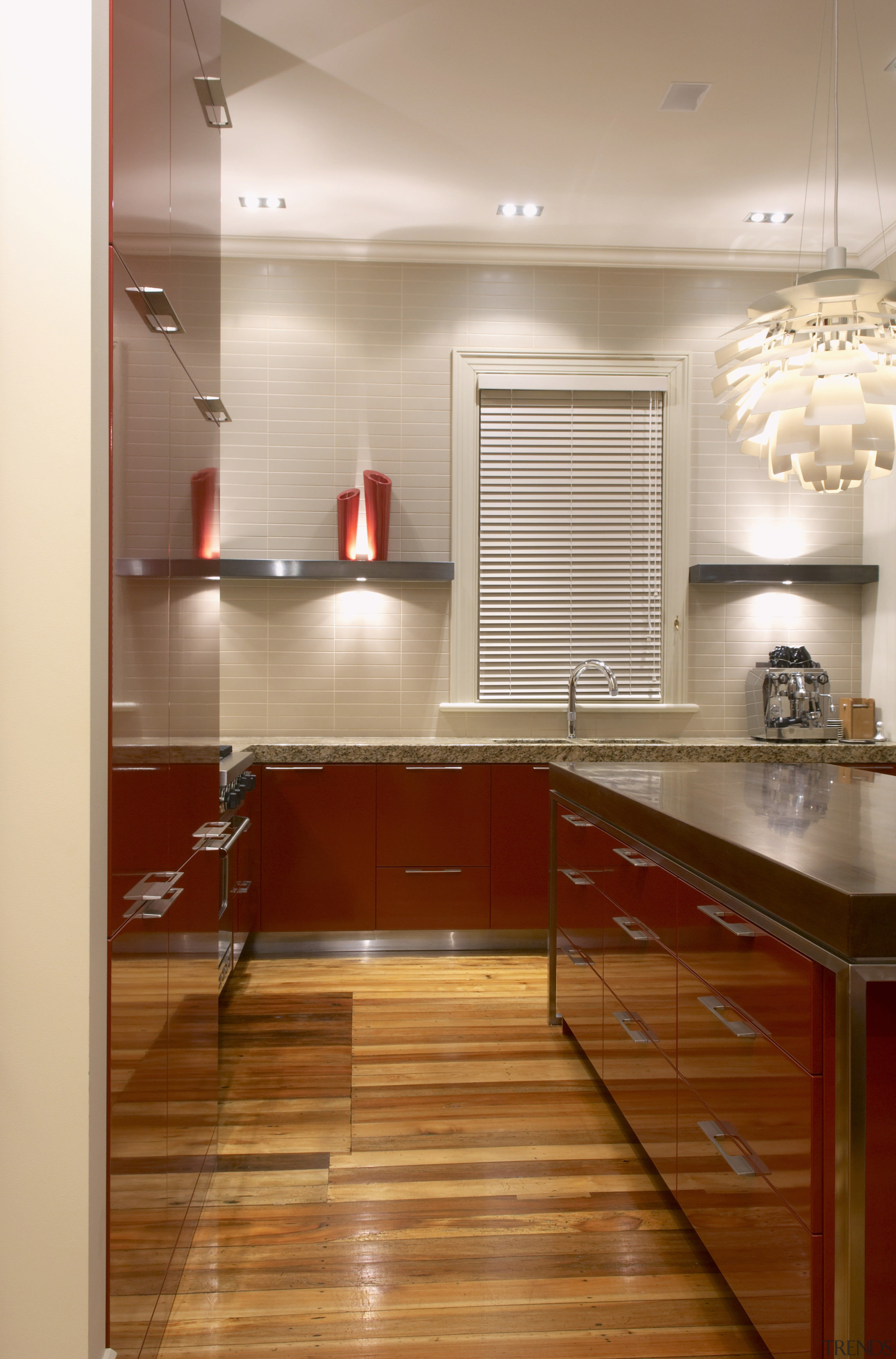 View of a modern kitchen which features a cabinetry, ceiling, countertop, cuisine classique, floor, flooring, hardwood, interior design, kitchen, laminate flooring, room, under cabinet lighting, wood, wood flooring, brown, white, orange