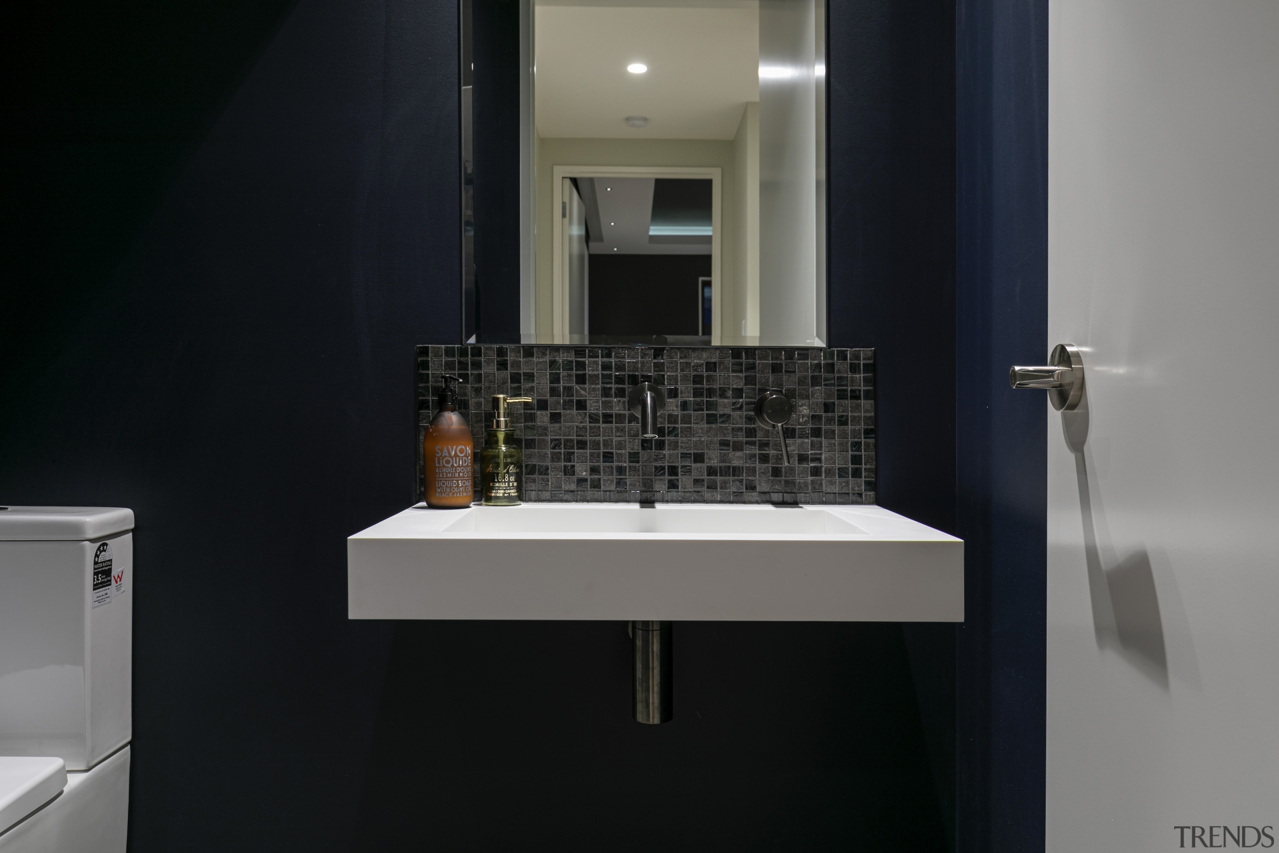 Black and grey mosaics in one bathroom are 