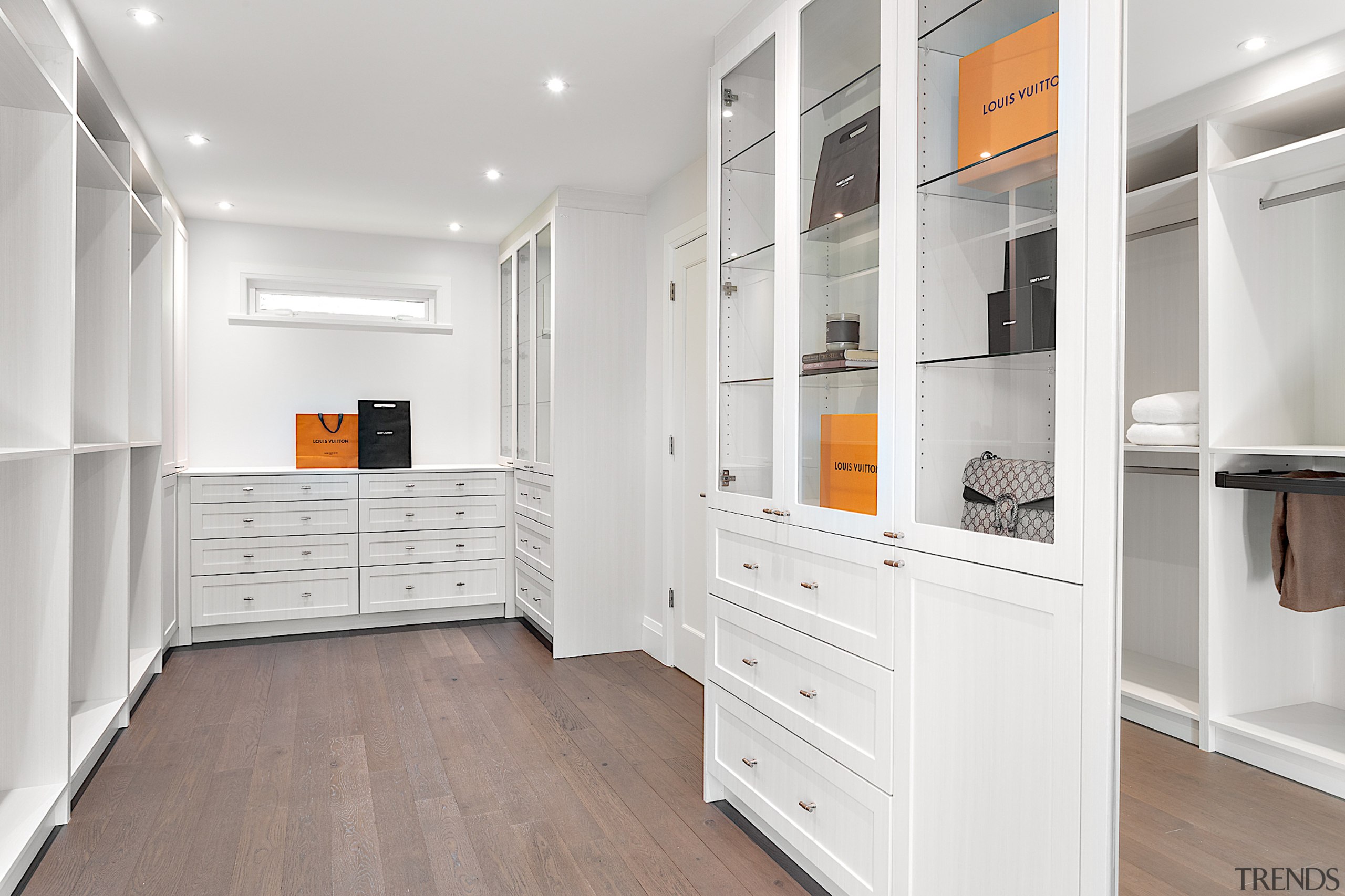 The dressing room with panelled cabinetry and glass 