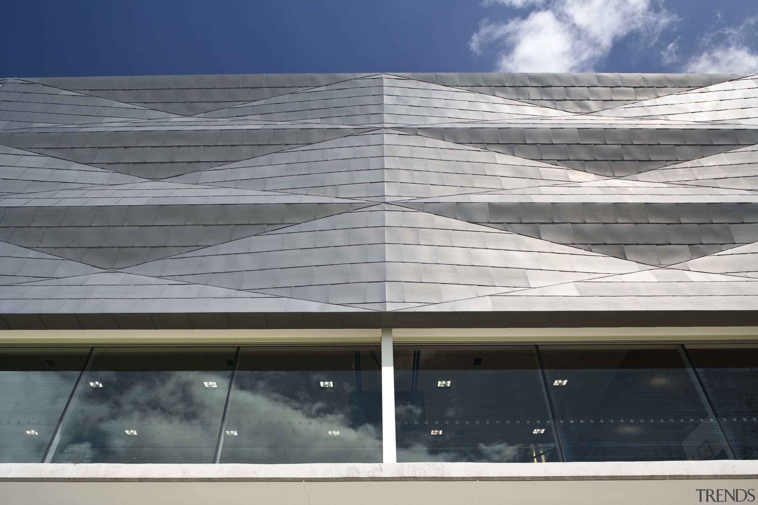 Exterior view of St Kents' Jubilee Sports Centre architecture, building, commercial building, condominium, corporate headquarters, daylighting, daytime, elevation, facade, glass, headquarters, line, reflection, roof, sky, structure, window, gray