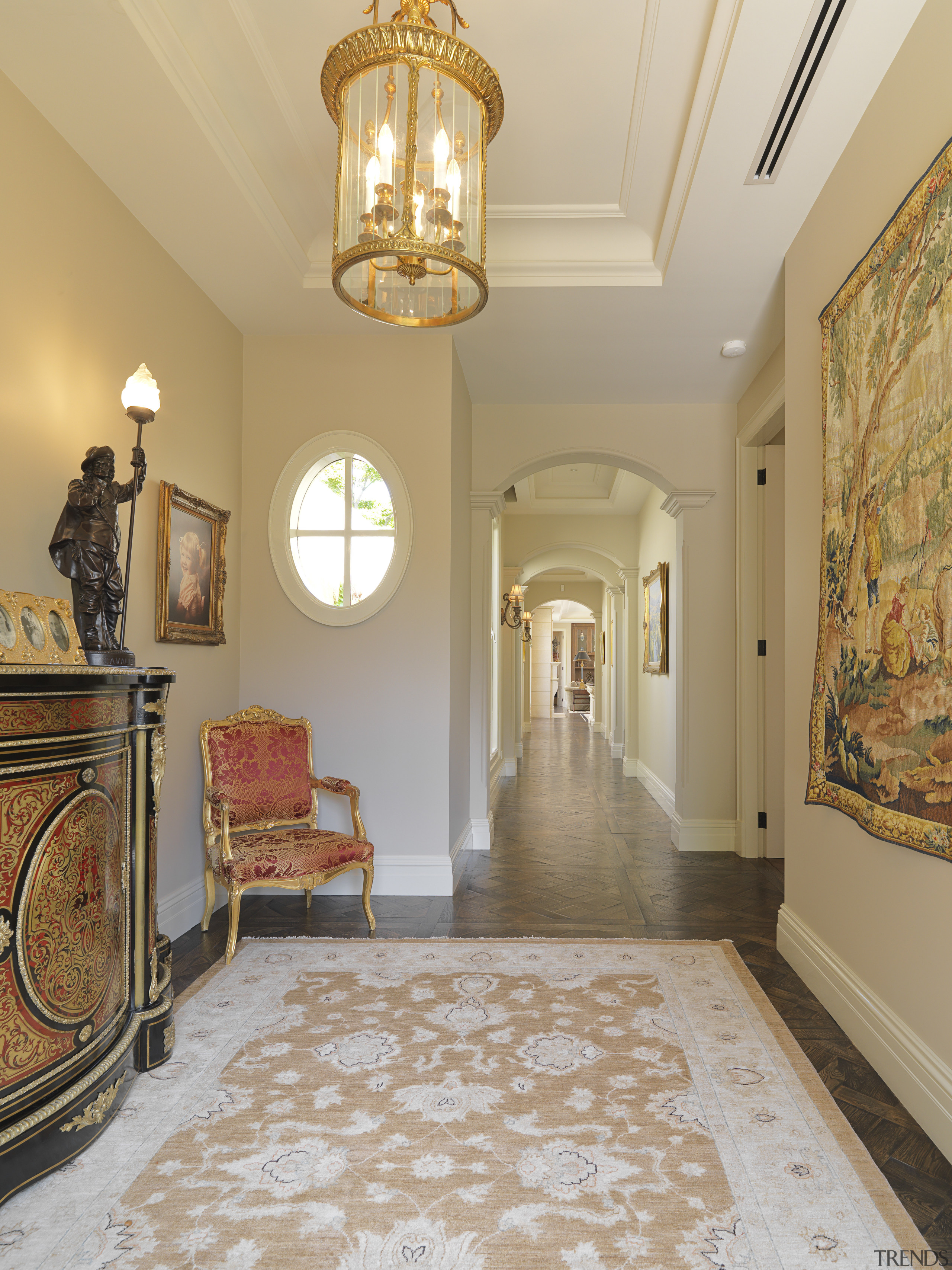 View of the hallway from this room features ceiling, estate, floor, flooring, hall, hardwood, home, interior design, lighting, living room, lobby, molding, property, real estate, room, wall, window, wood flooring, orange, gray