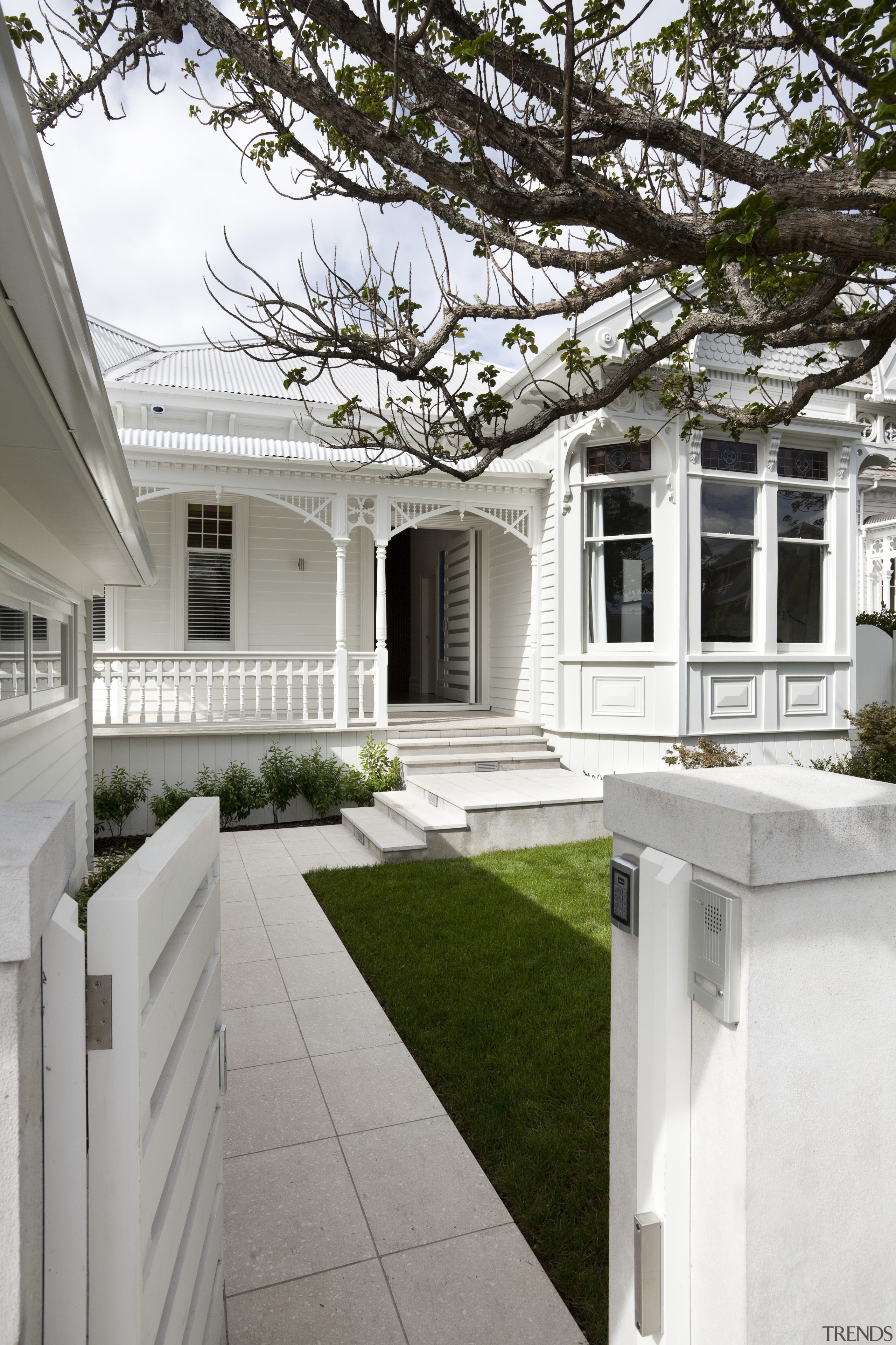 Path leading up to house with white exterior architecture, backyard, courtyard, estate, facade, home, house, mansion, neighbourhood, outdoor structure, porch, property, real estate, residential area, siding, walkway, window, yard, white, gray