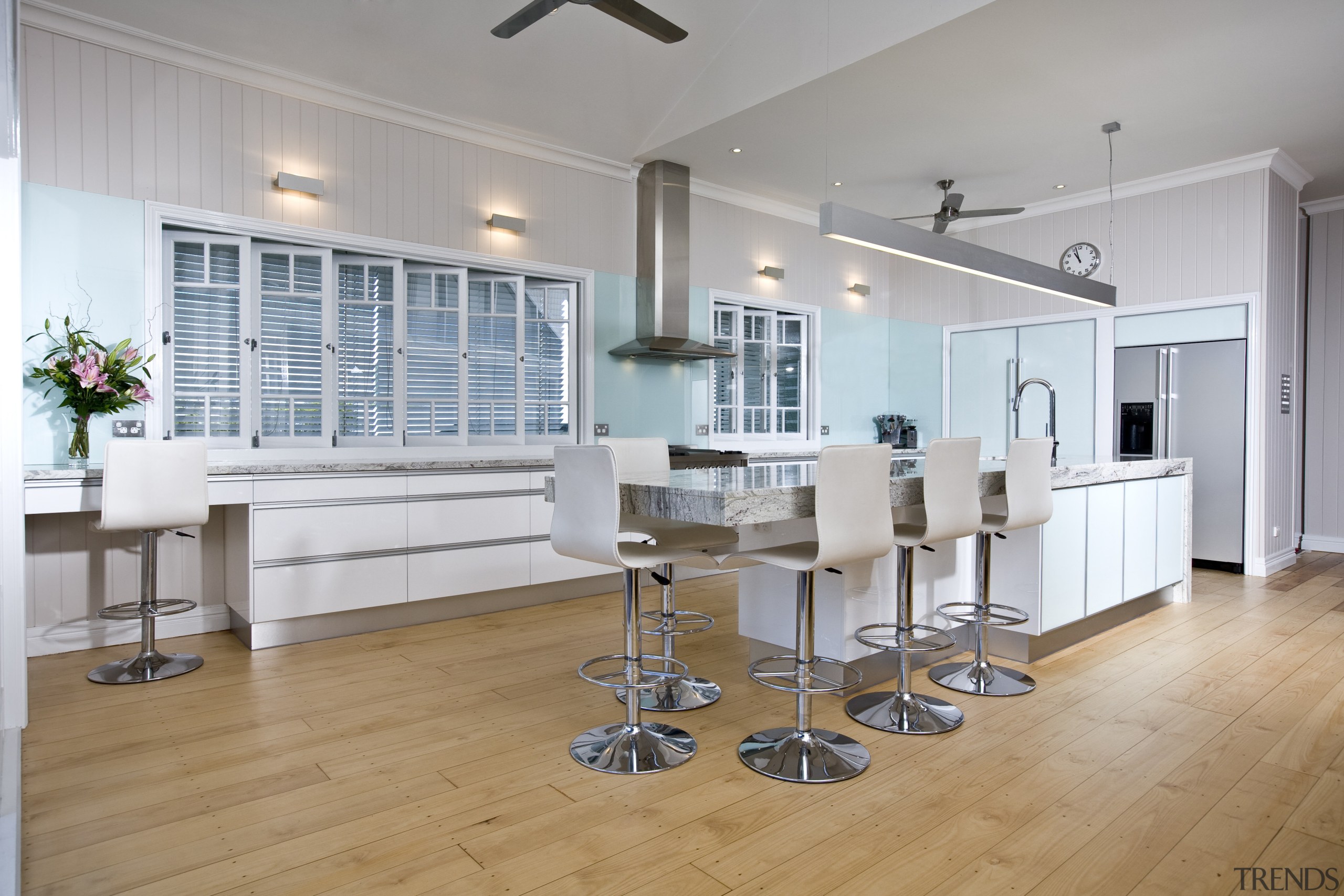 A view of a kitchen designed by KBDI. floor, flooring, hardwood, interior design, kitchen, property, real estate, room, wood flooring, gray