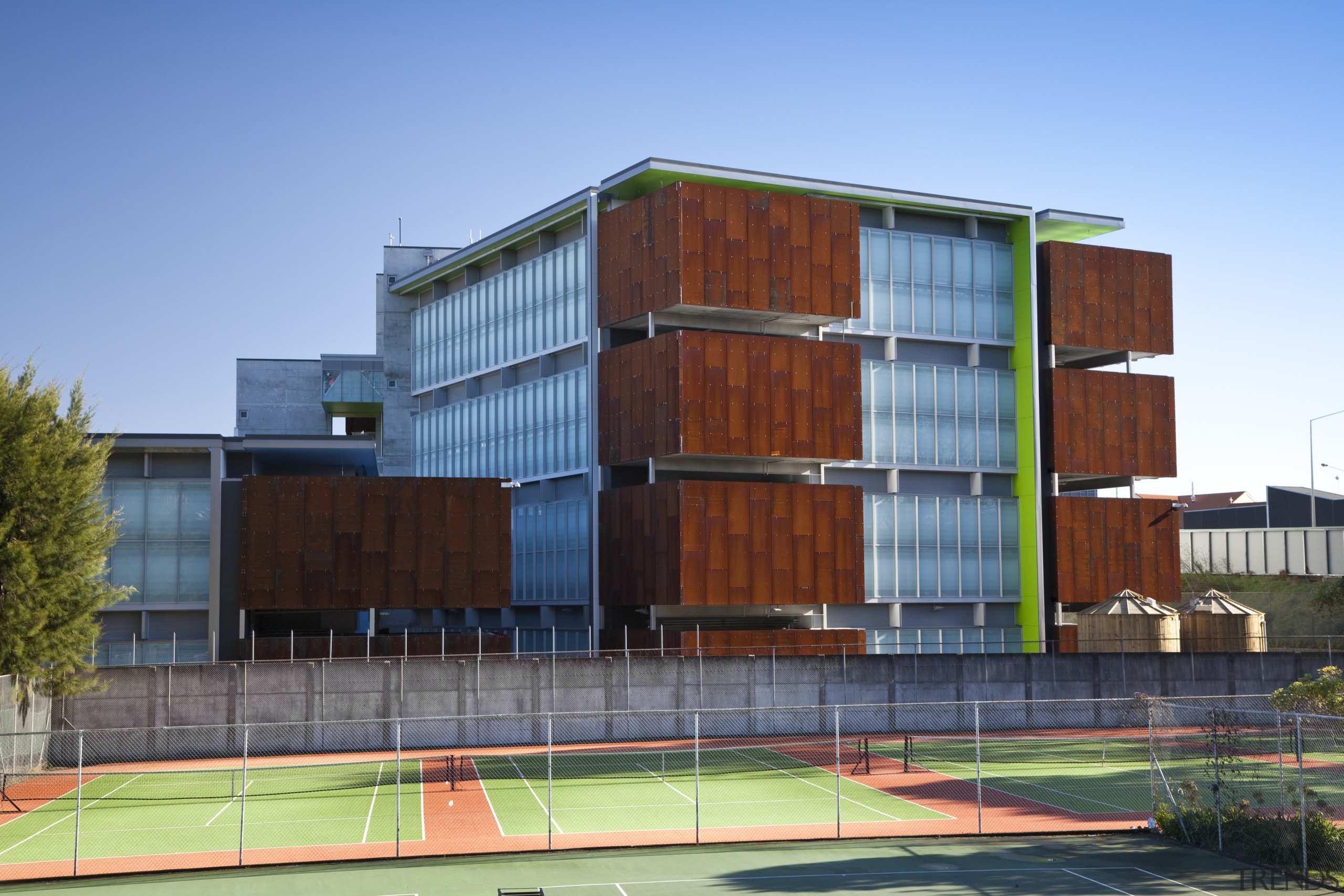 View of the Mt Eden Corrections Facility. - apartment, architecture, building, commercial building, condominium, corporate headquarters, elevation, facade, home, house, mixed use, real estate, residential area, teal