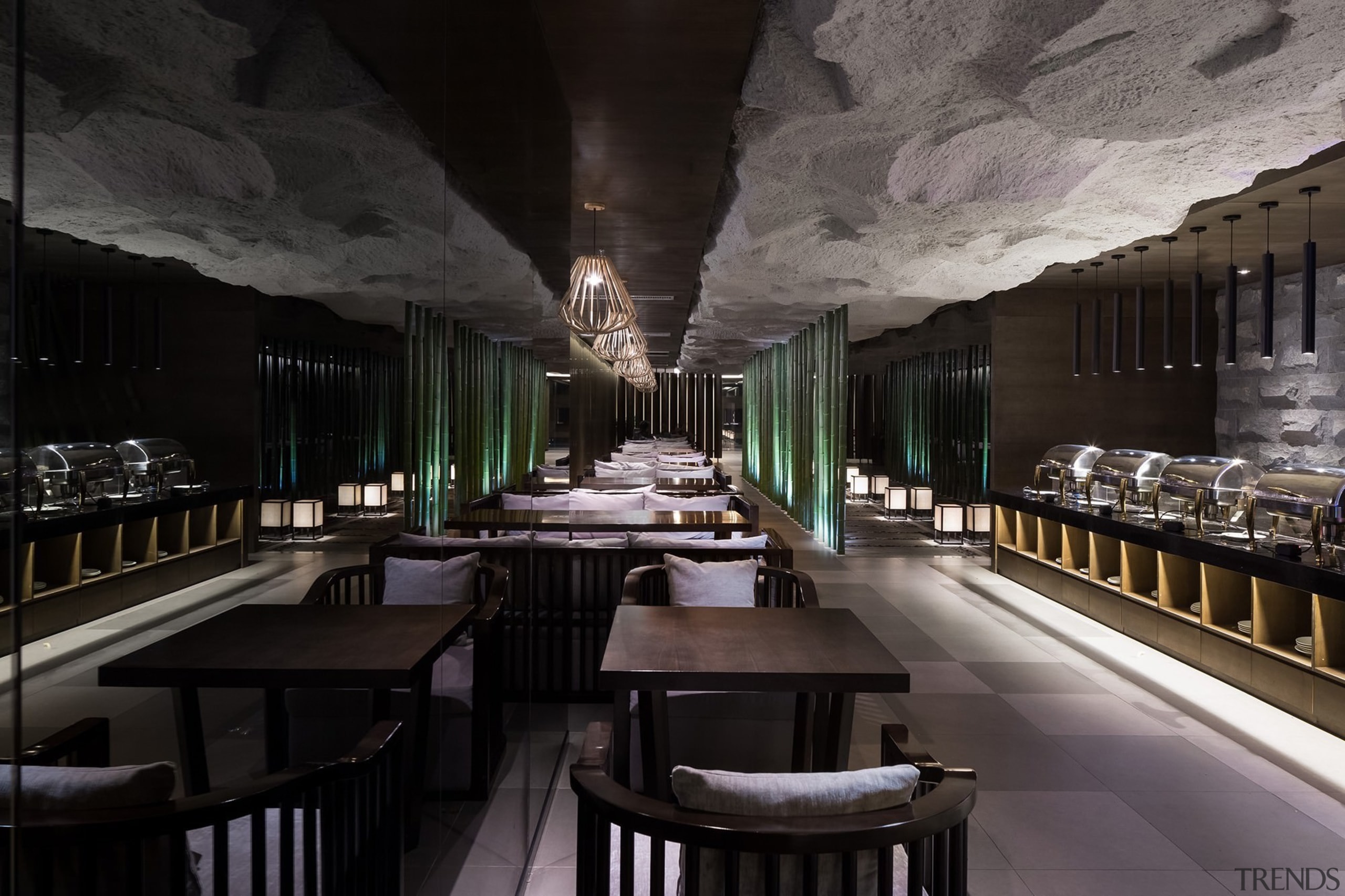 A rocky ceiling runs above the dining area interior design, restaurant, black, gray