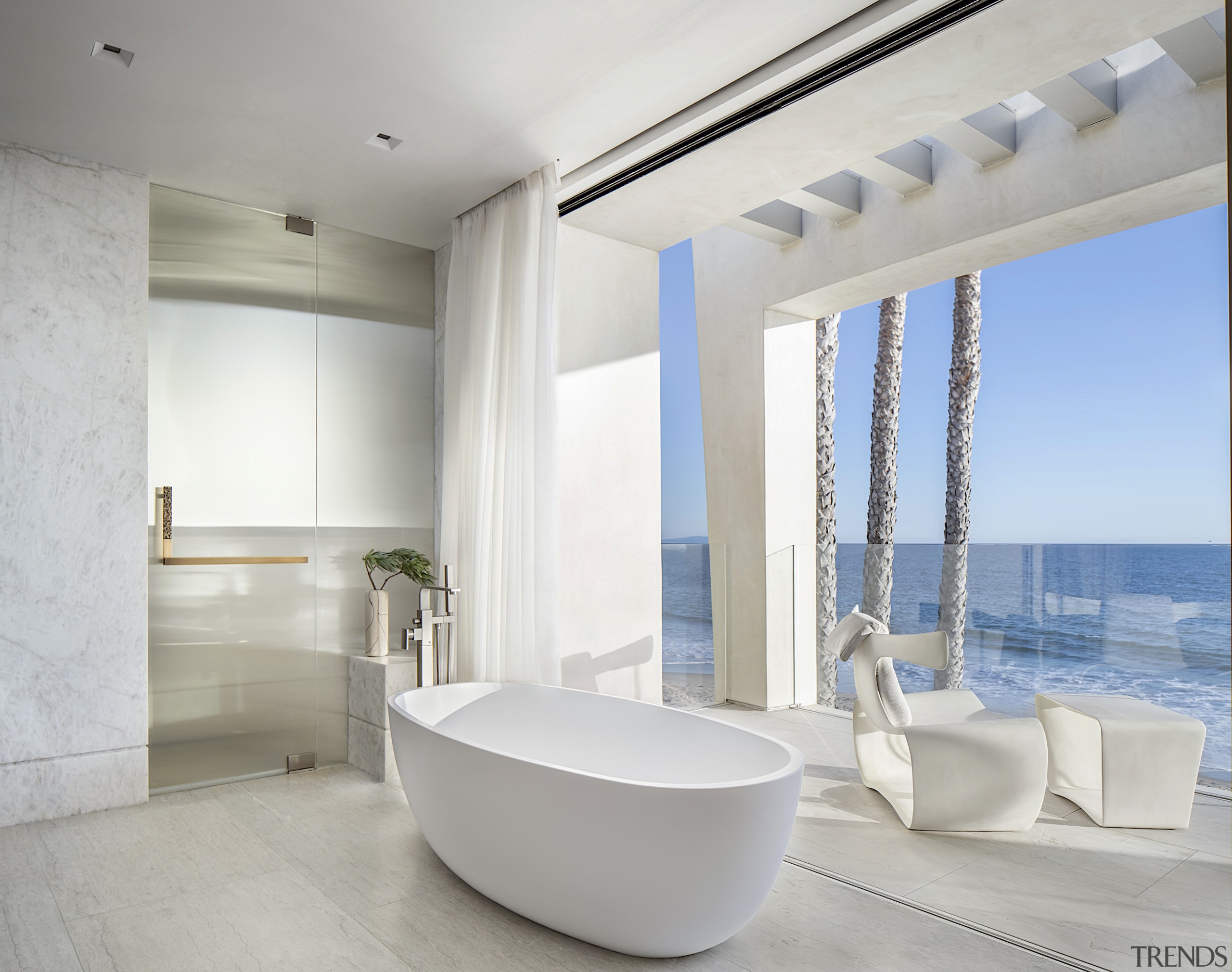 The master ensuite with retractable glass walls behind. 