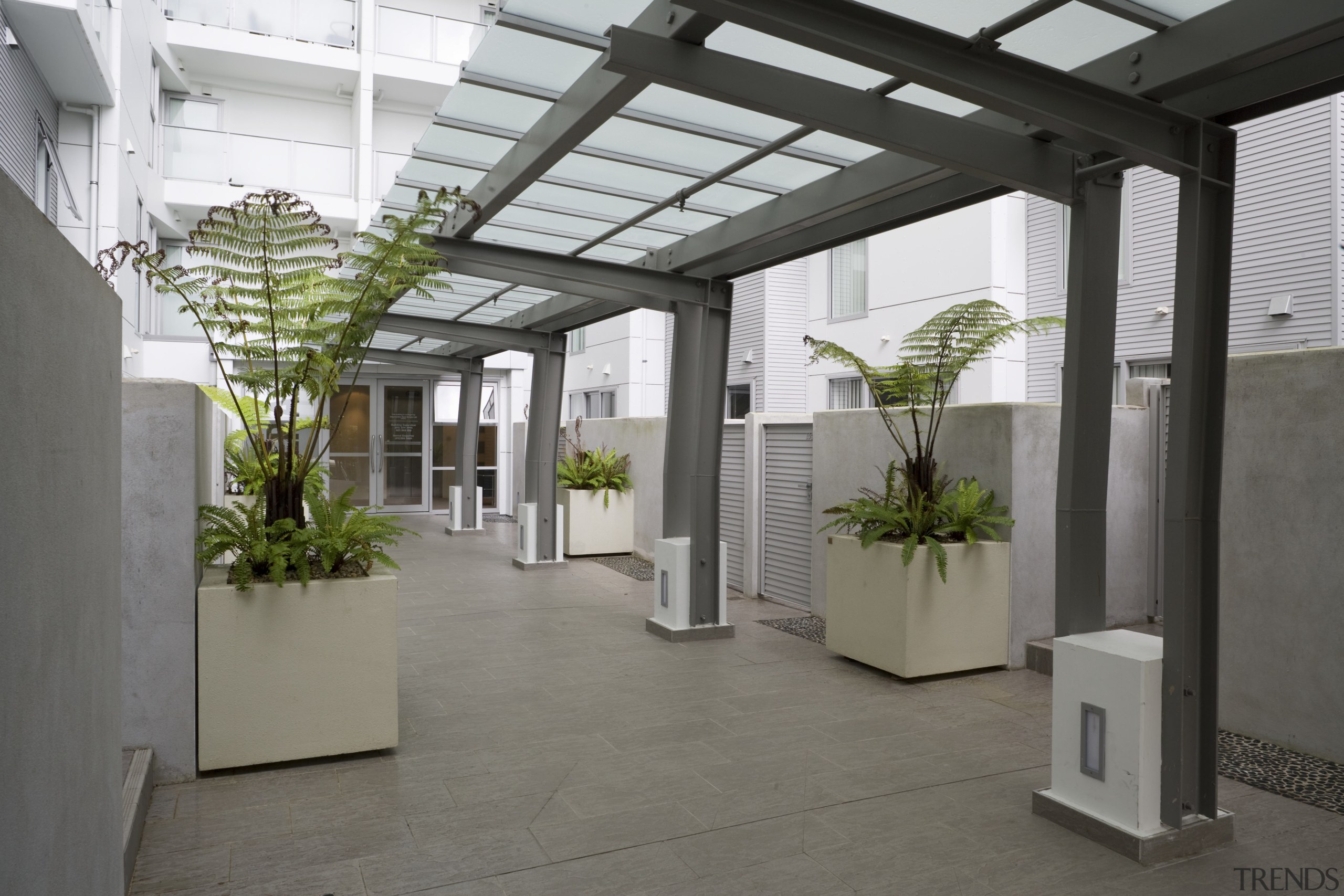 View of a two-storey maisonette which lines the courtyard, daylighting, interior design, property, real estate, roof, gray