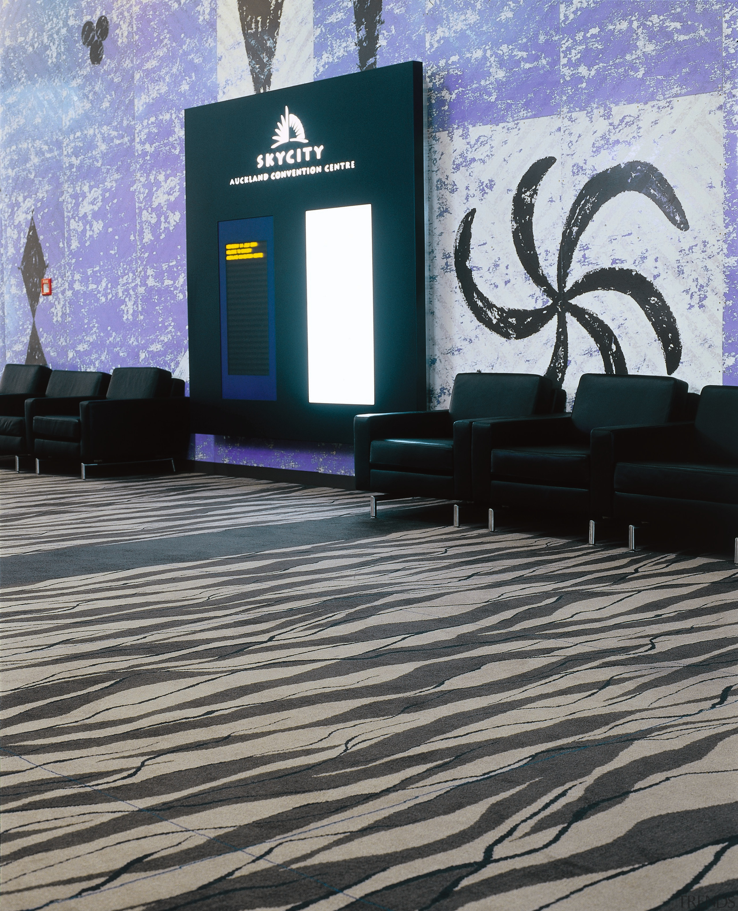 Public area of convention centre with purple and floor, flooring, wall, black, gray
