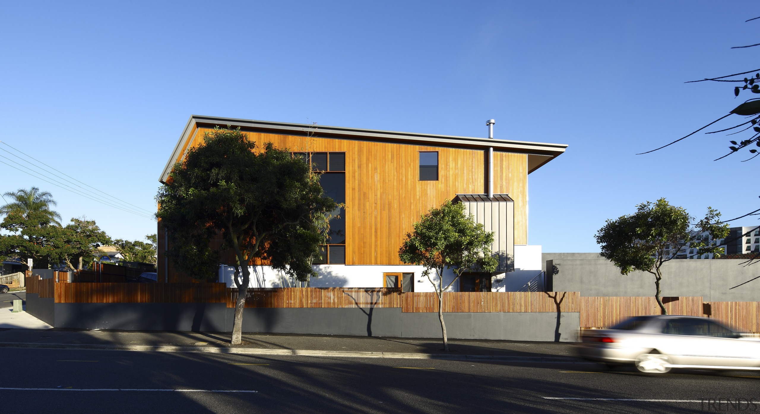 This home was designed by Angus Munro of architecture, building, facade, home, house, neighbourhood, real estate, residential area, sky, tree, teal, black