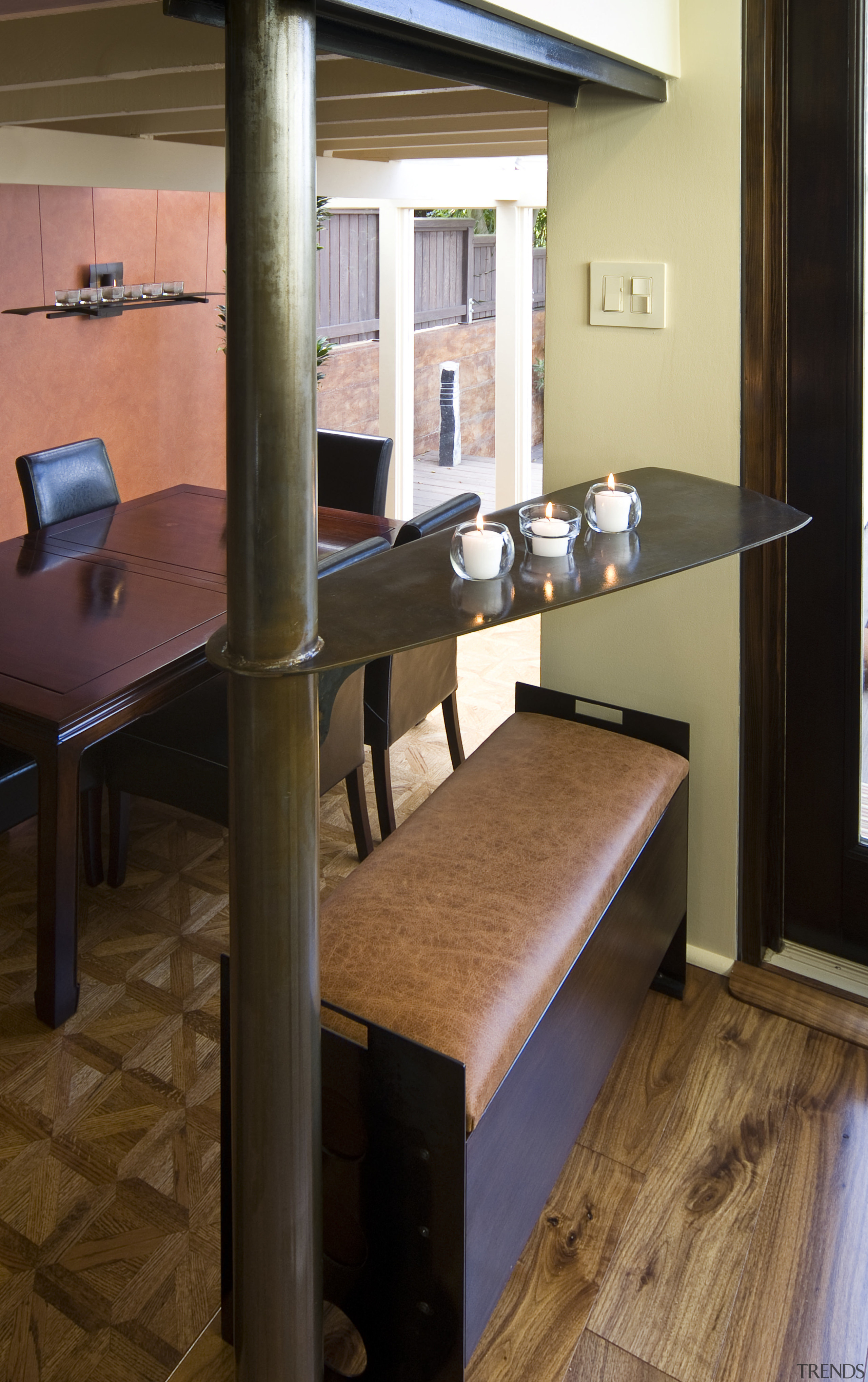 View of a kitchen which features a structural chair, desk, floor, flooring, furniture, hardwood, room, table, wood, brown