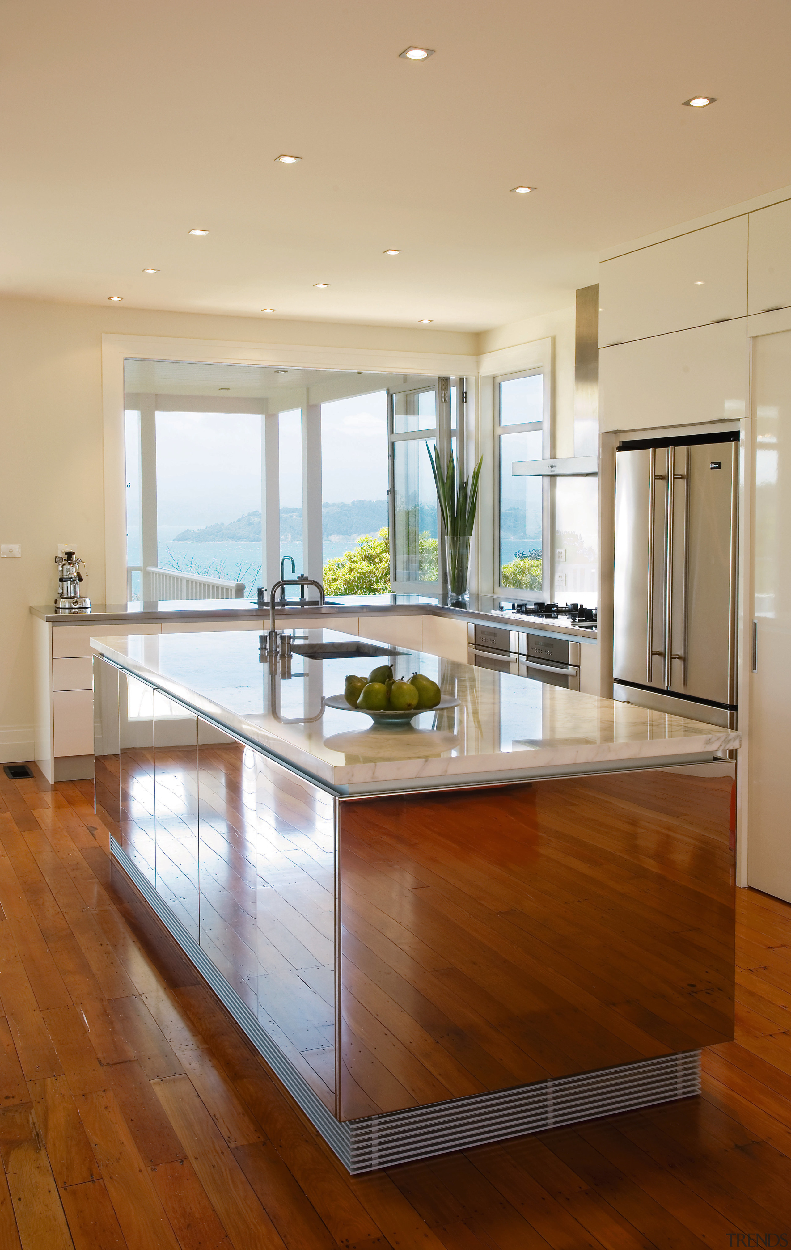 The intention was to design a kitchen that cabinetry, ceiling, countertop, floor, flooring, hardwood, interior design, kitchen, laminate flooring, living room, real estate, room, table, window, wood, wood flooring, orange, brown