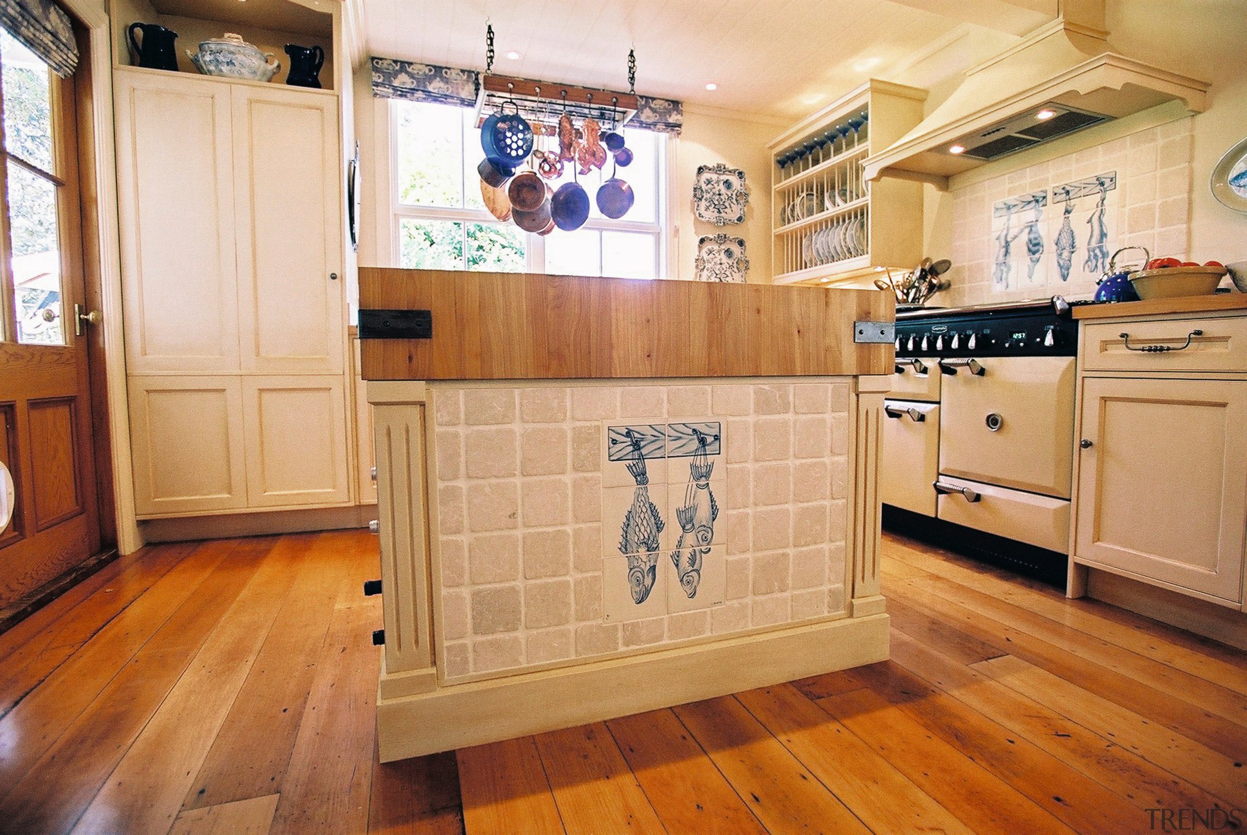 Traditional style kitchen with cream walls and cabinetry, cabinetry, countertop, floor, flooring, hardwood, home, interior design, kitchen, laminate flooring, property, real estate, room, tile, wall, wood, wood flooring, orange, brown