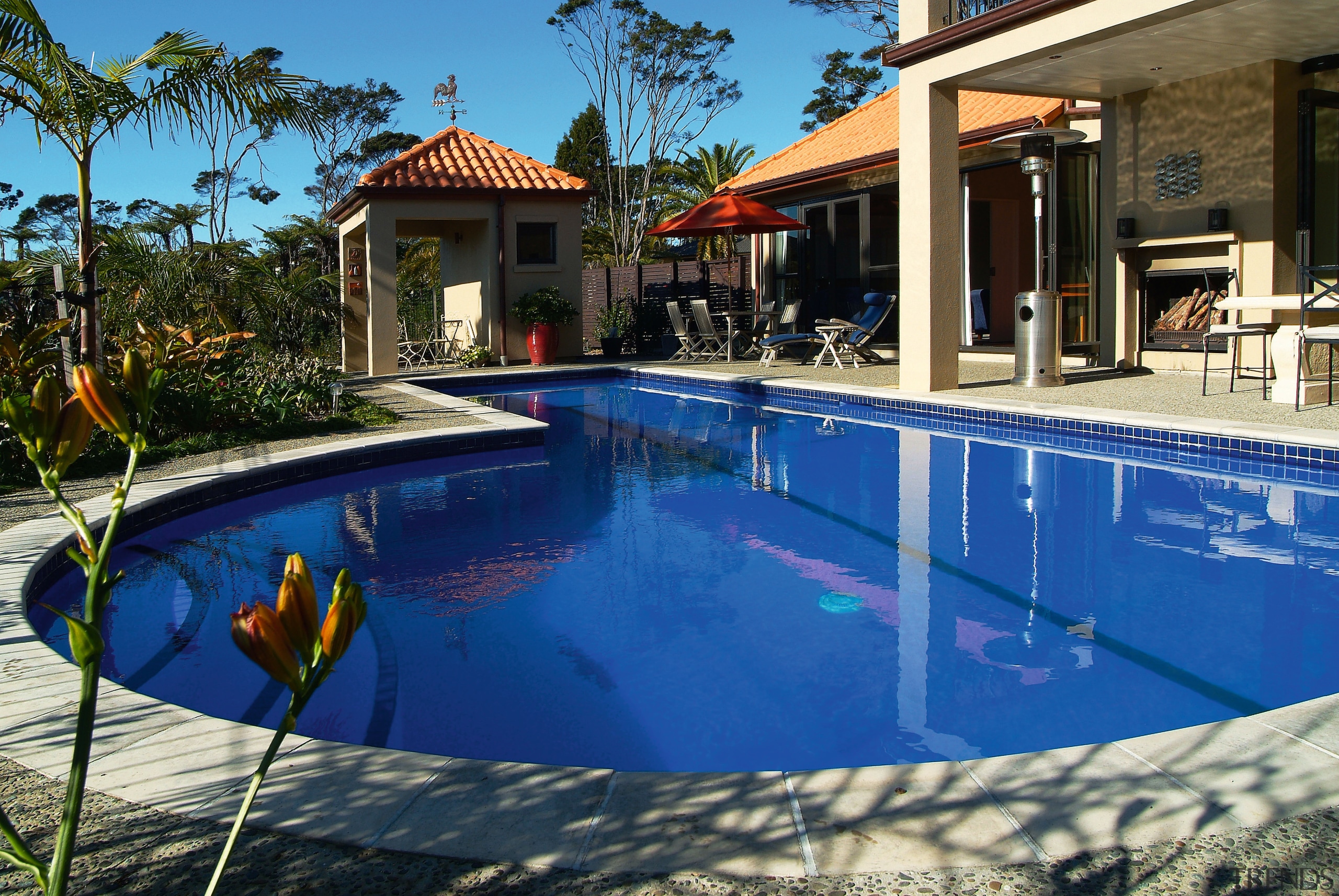 A view of a swimming pool by Mayfair estate, hacienda, home, house, leisure, property, real estate, resort, swimming pool, villa, blue