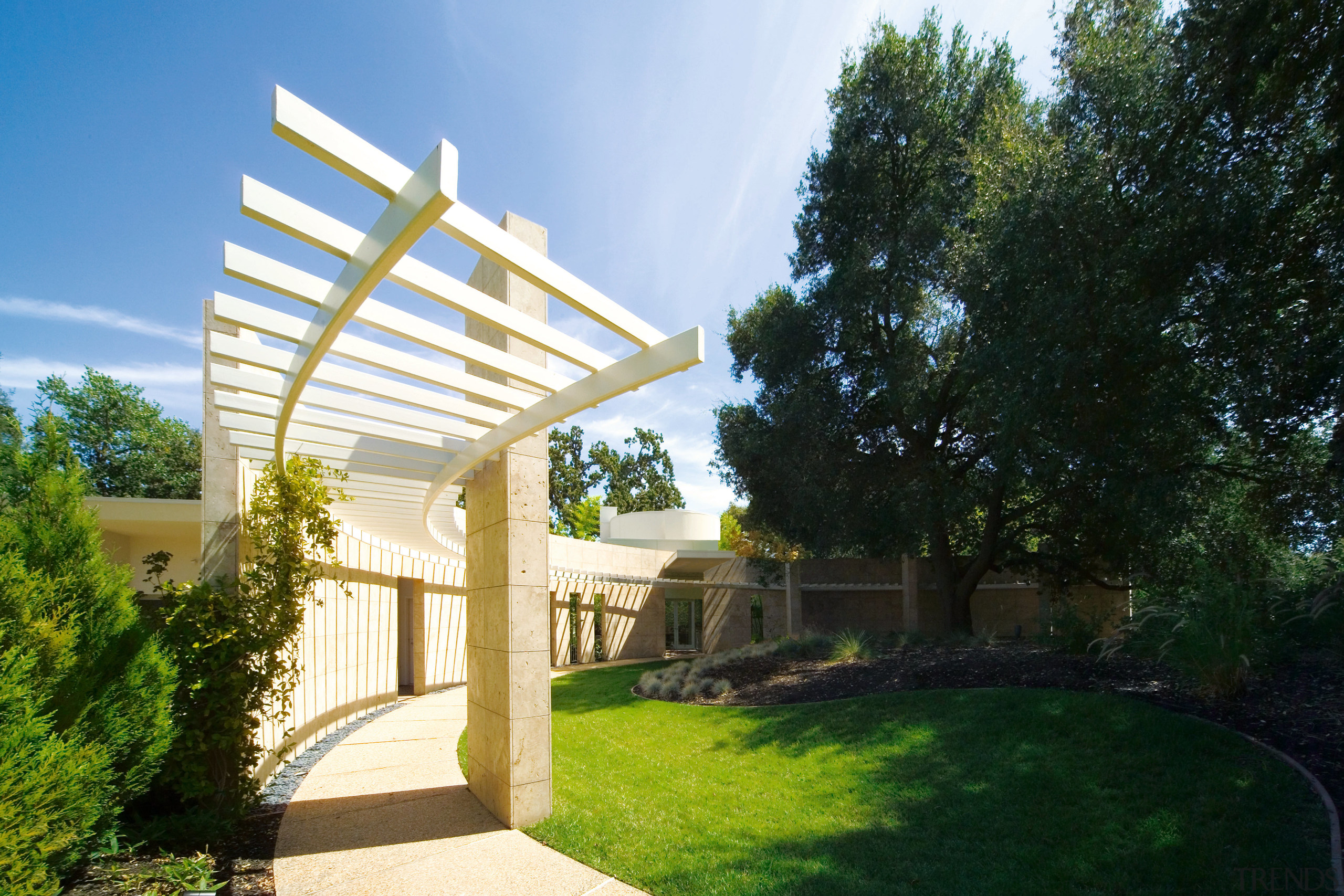 A view of the entrance way and courtyard. architecture, backyard, estate, grass, home, house, landscape, landscaping, outdoor structure, property, real estate, residential area, villa, yard, black