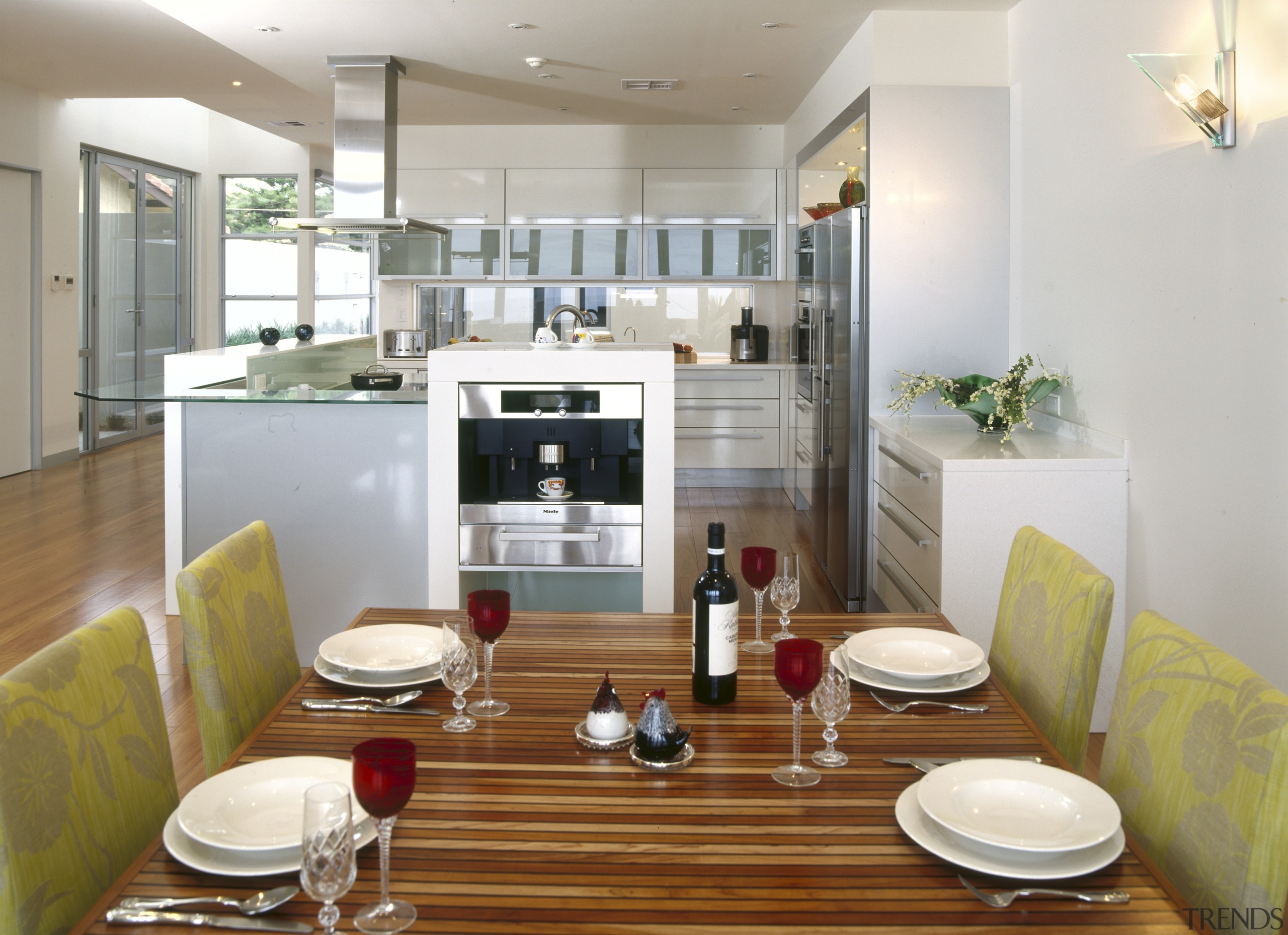 View of kitchen and dining area which features apartment, dining room, interior design, kitchen, living room, property, real estate, room, white, brown