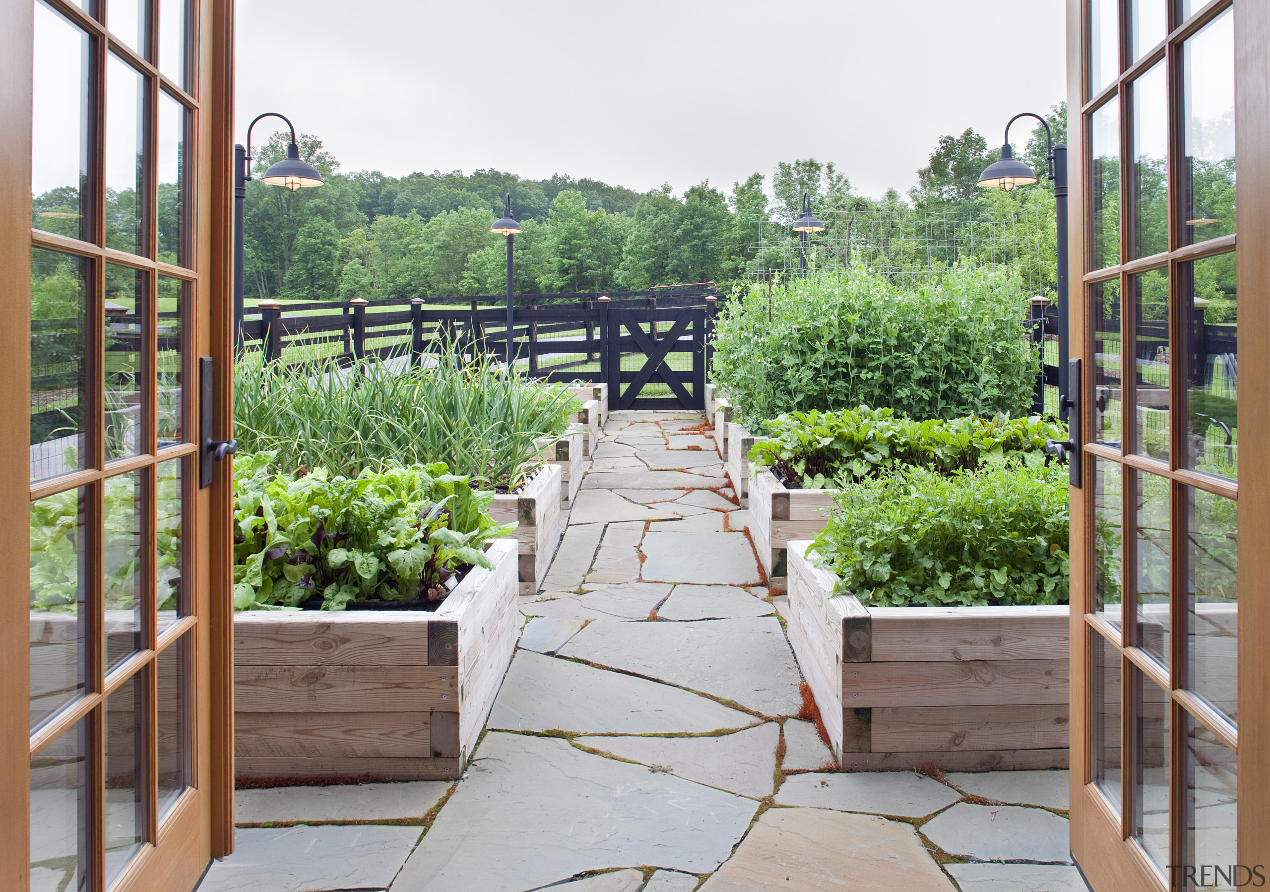 View of stone pathway and planter boxes. - backyard, balcony, handrail, home, outdoor structure, plant, property, real estate, walkway