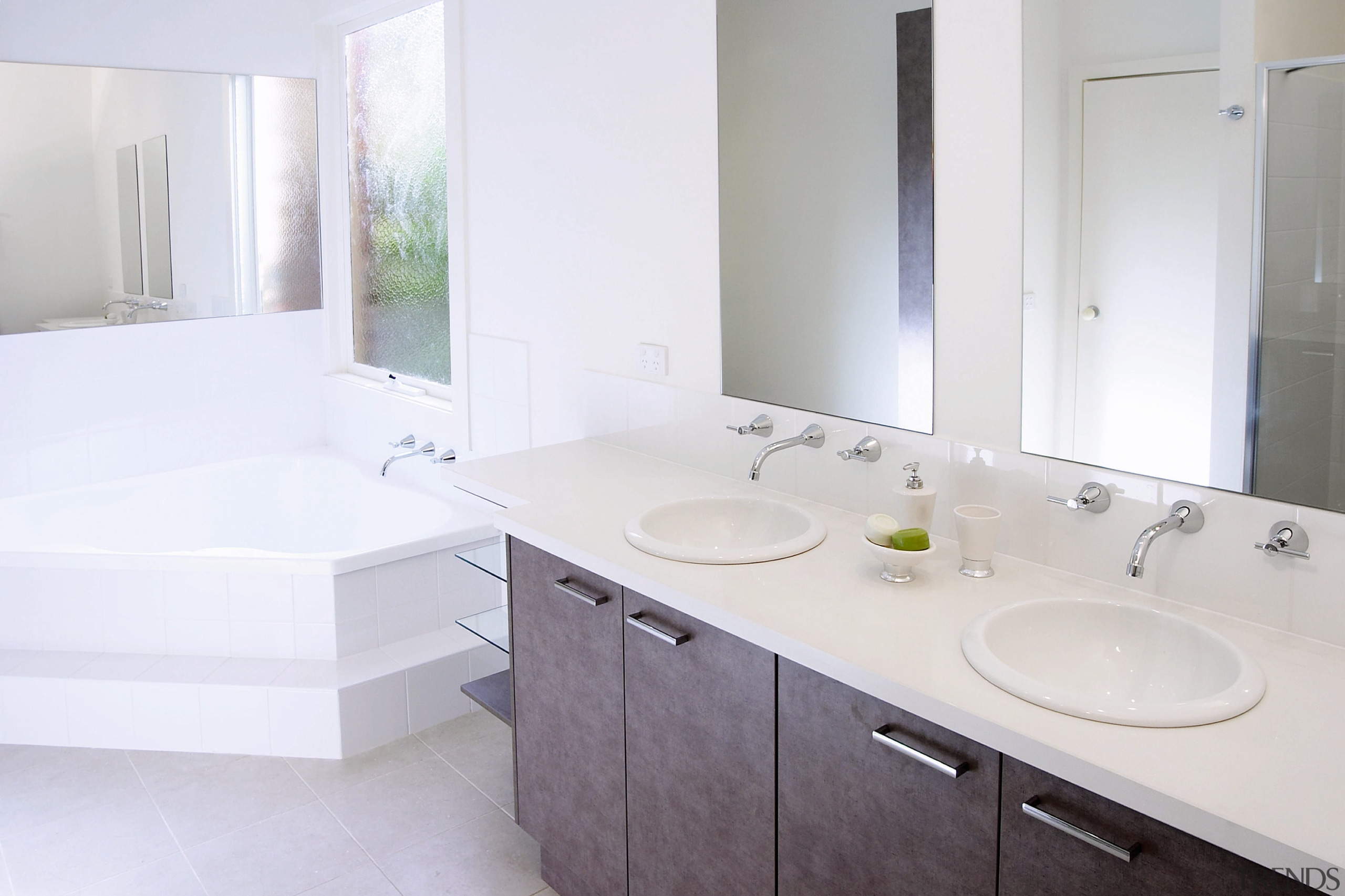 Bathroom with white corner bath, cream vanity top bathroom, bathroom accessory, bathroom cabinet, bathroom sink, countertop, floor, home, interior design, property, real estate, room, sink, tap, white