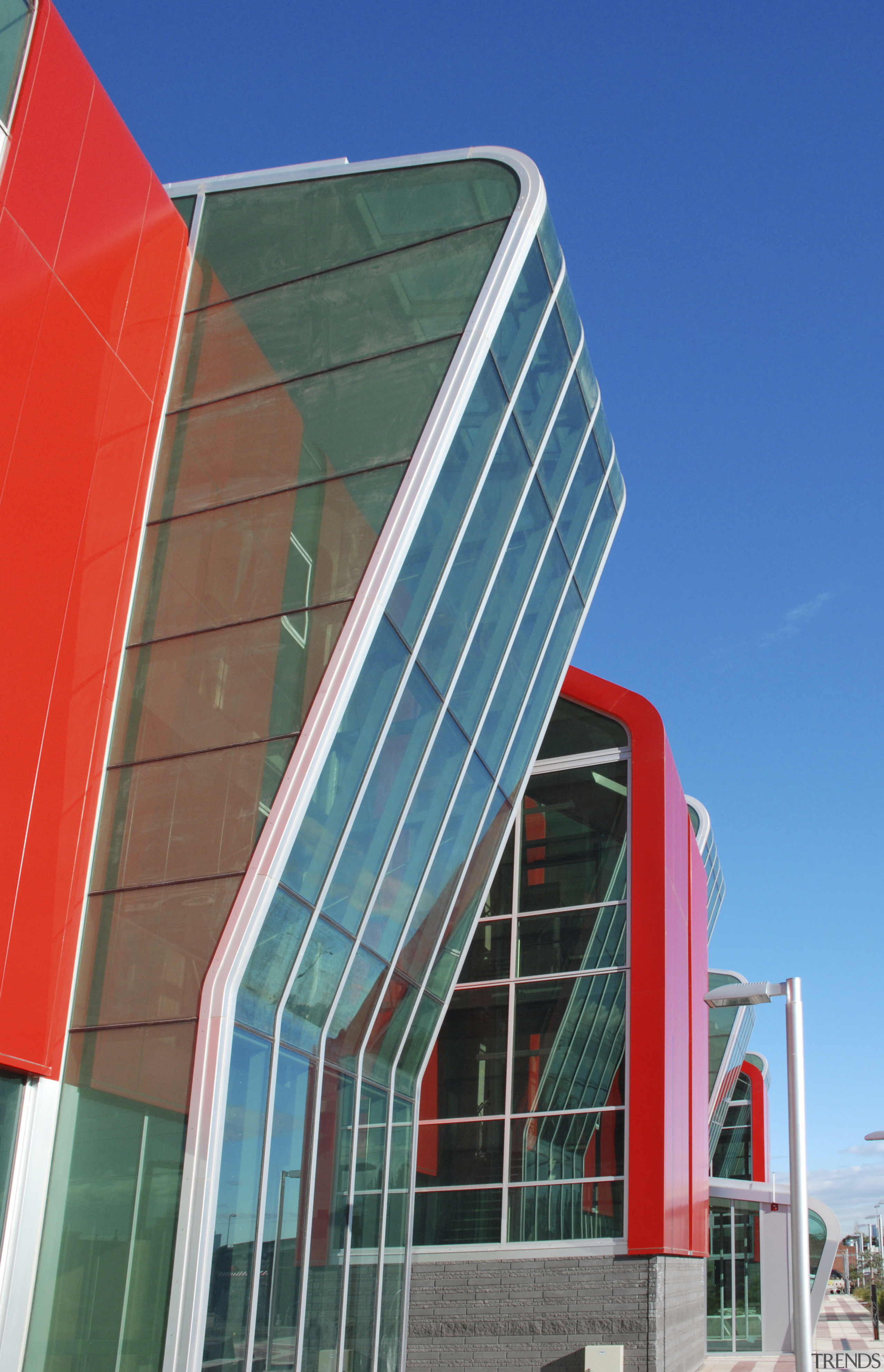 Image of curved glazing from on this fire architecture, building, commercial building, corporate headquarters, daylighting, daytime, facade, headquarters, landmark, line, metropolitan area, real estate, sky, skyscraper, structure, urban area, window, blue