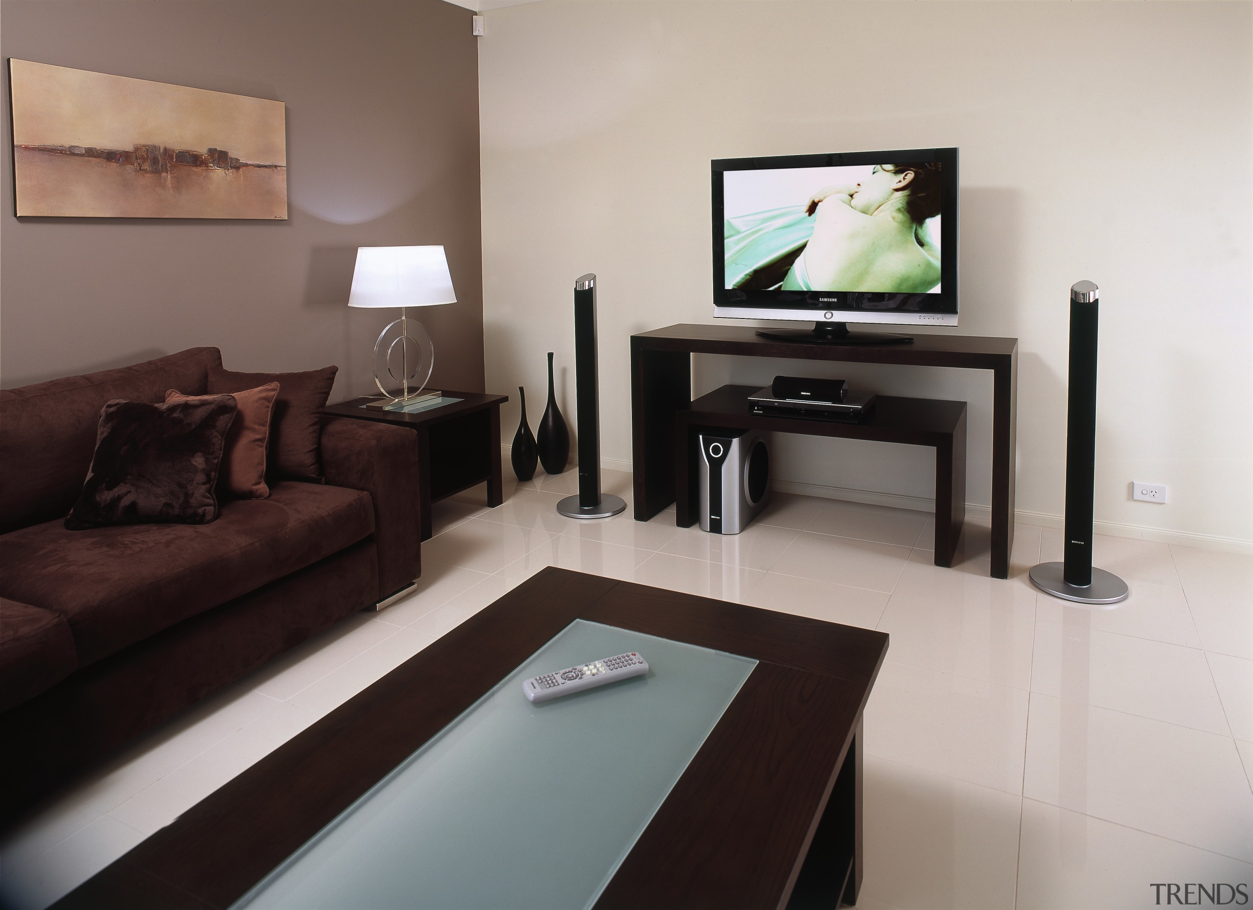 samsungs 40inch m series lcd tv has a floor, furniture, interior design, living room, property, room, suite, table, gray, black